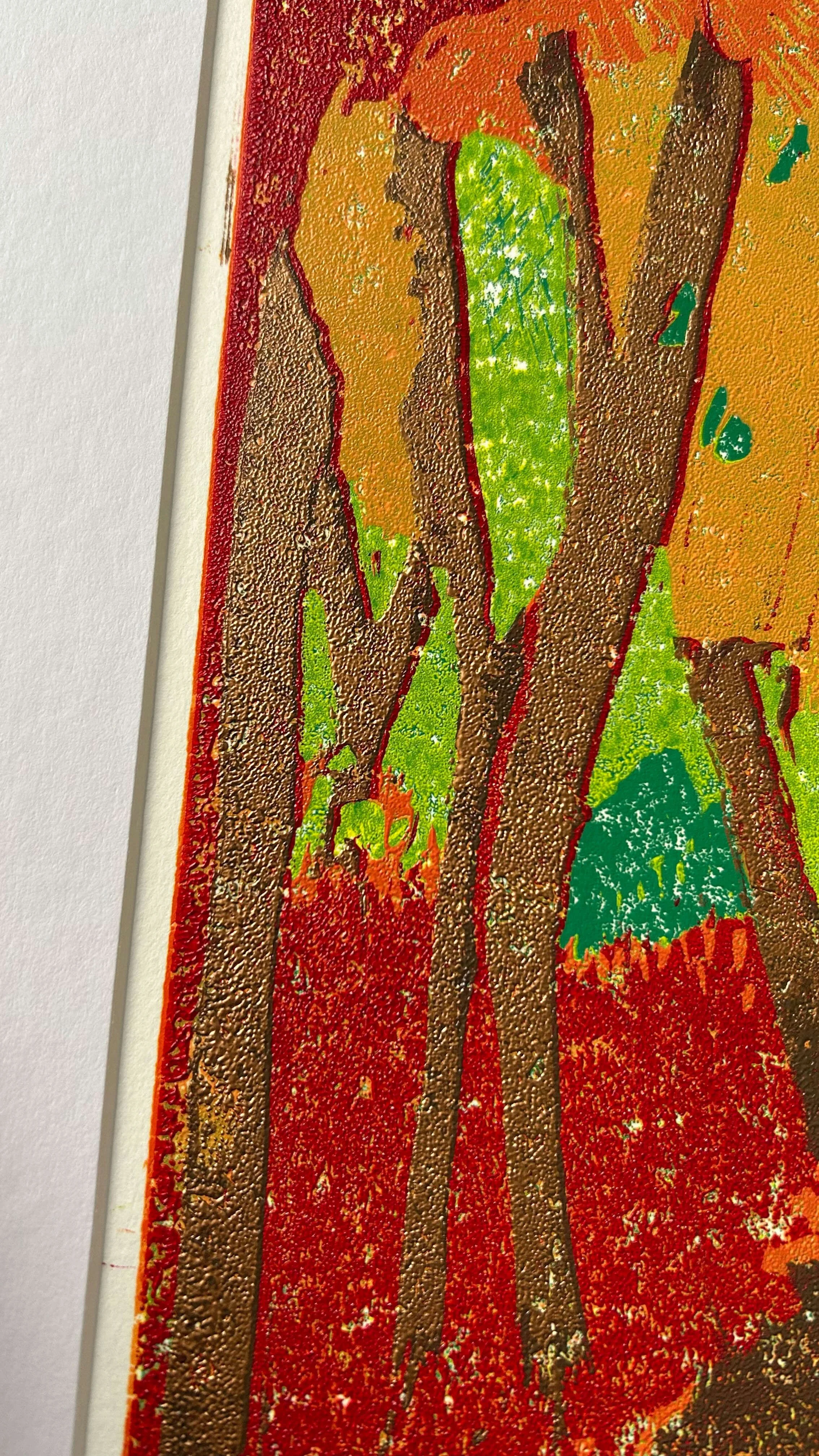 The Corridor of Colour with mount detail Autumnal Linocut of path lined with trees in oranges, yellows and reds with pops of green and copper highlights on the trunks in the foreground