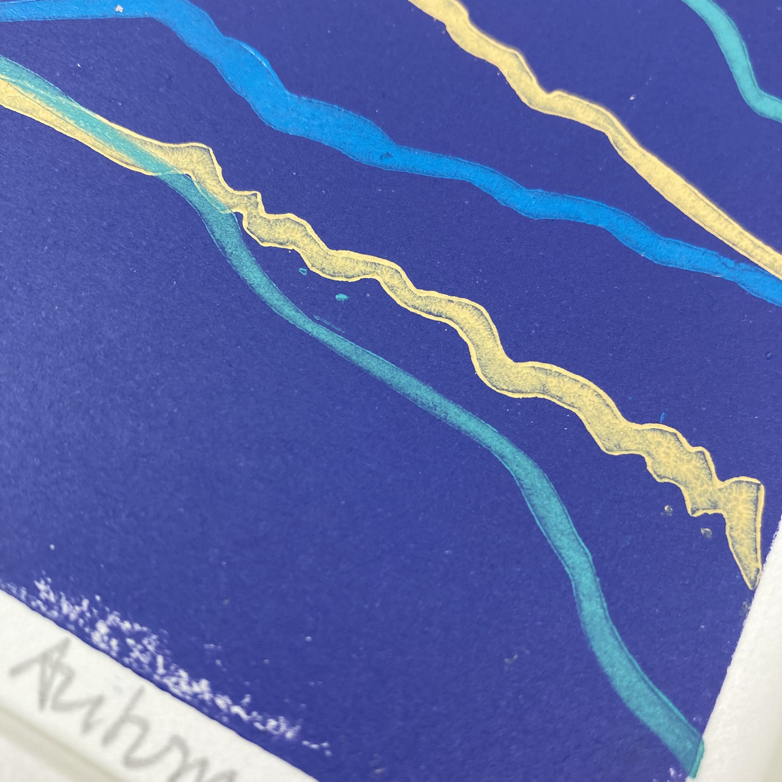 Close up detail of dusky purple print with ochre, navy and blue lino print signed and in a mount (Copy)