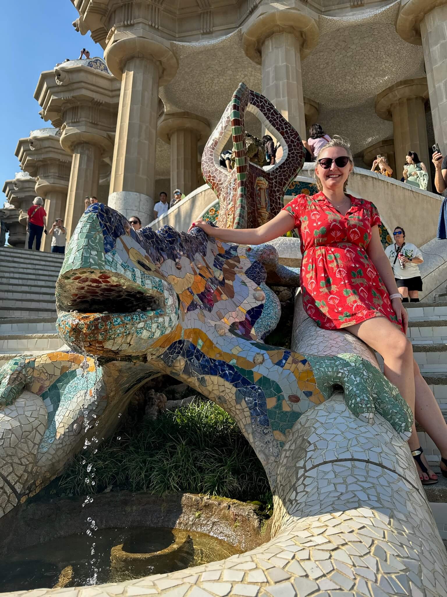 Heather Moore sitting next to the lizard in Park Güell