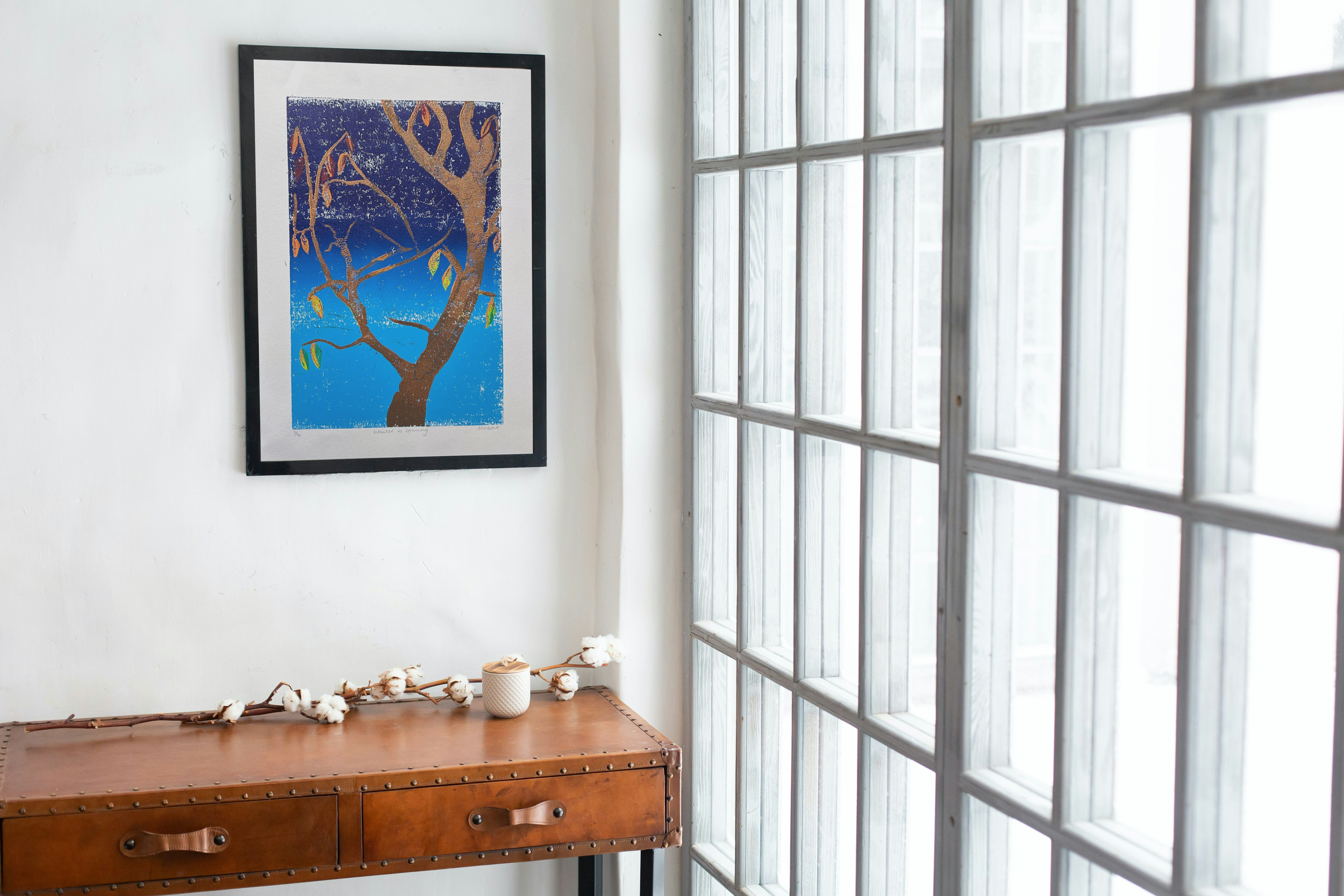 Mock Up of Winter is Coming in White Room with Large Glass Doors.png