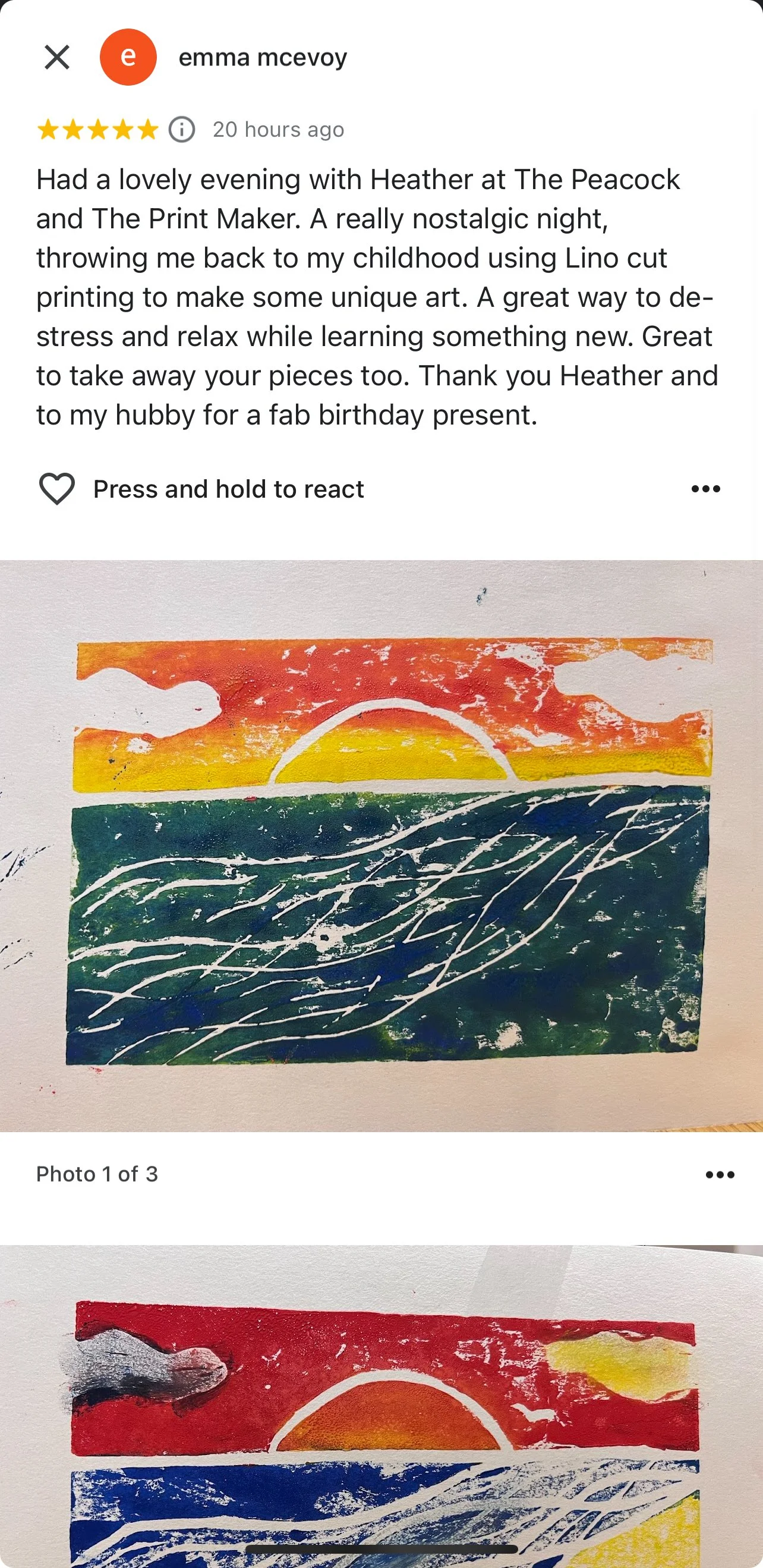 Handmade block print of a sunset over the ocean, with a semi-circle sun partially below the horizon and wavy lines representing water, using vibrant colors of orange, yellow, green, blue, and white.