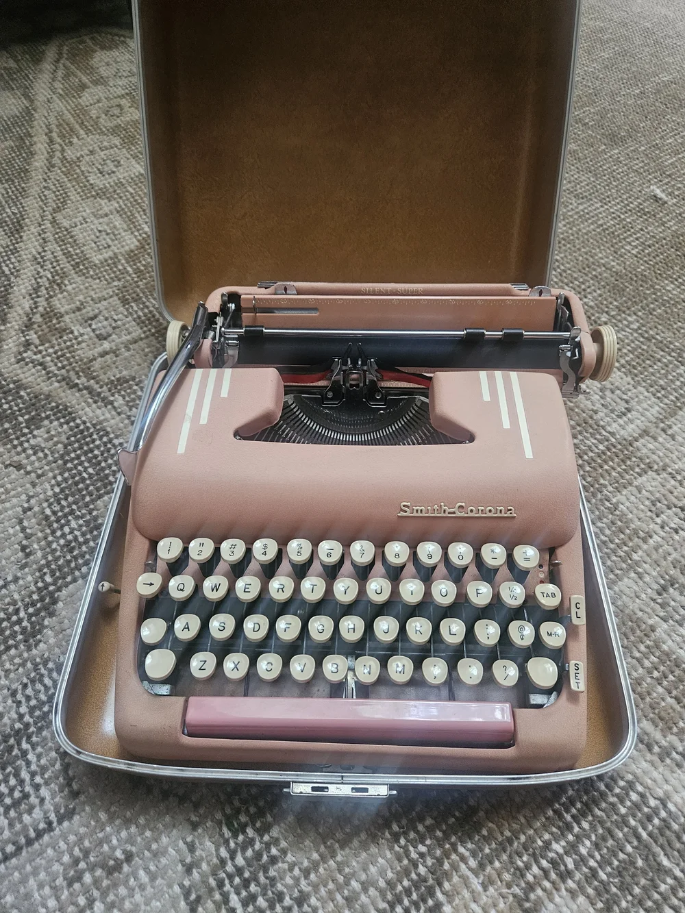 Circa 1955 Smith Corona Silent Super pink typewriter with Holiday