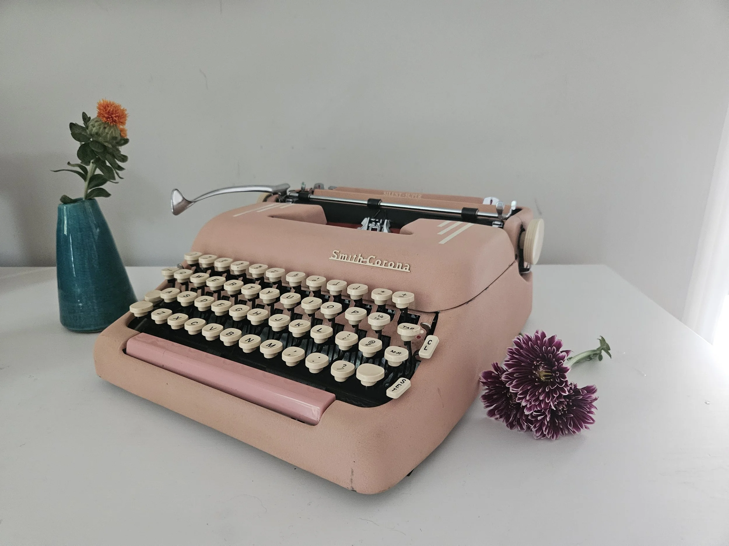 Circa 1955 Smith Corona Silent Super pink typewriter with Holiday
