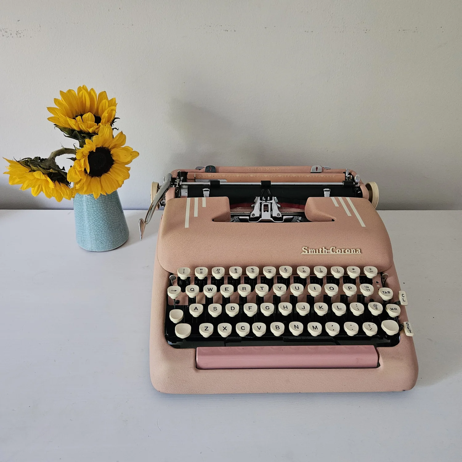 Circa 1955 Smith Corona Silent Super pink typewriter with Holiday