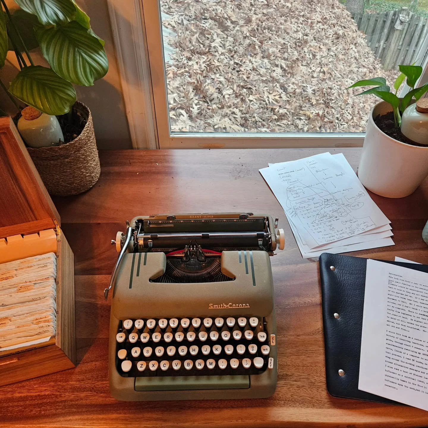 Finishing up The Screenless Writer book. I have aleather folio I put the draft in as I finalize the order. That's my wooden NEXUS Zettelkasten. (ANTInet). One of the reasons this book has taken so long as because I am also researching and refining th