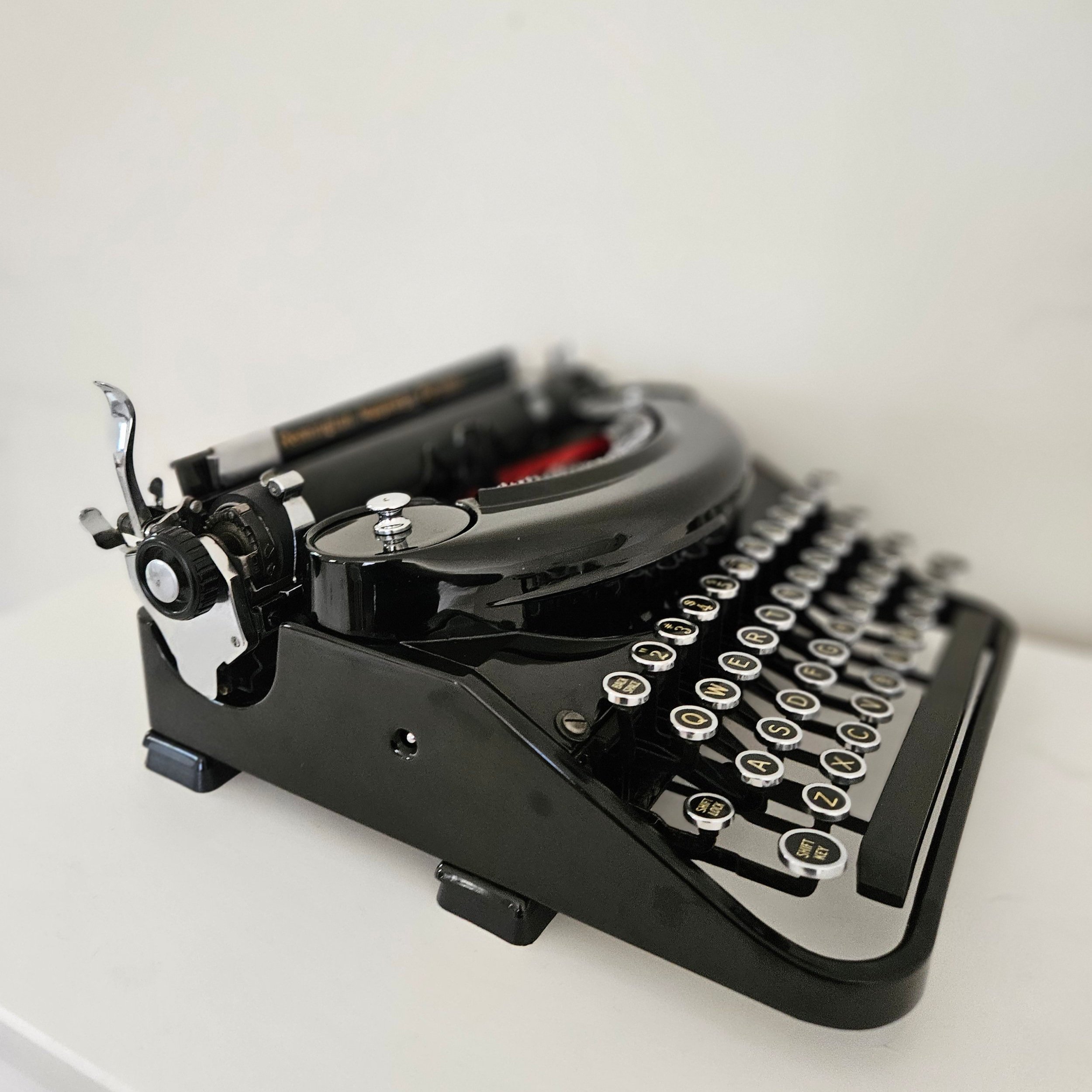 Restored Remington Noiseless portable typewriter in gloss black.