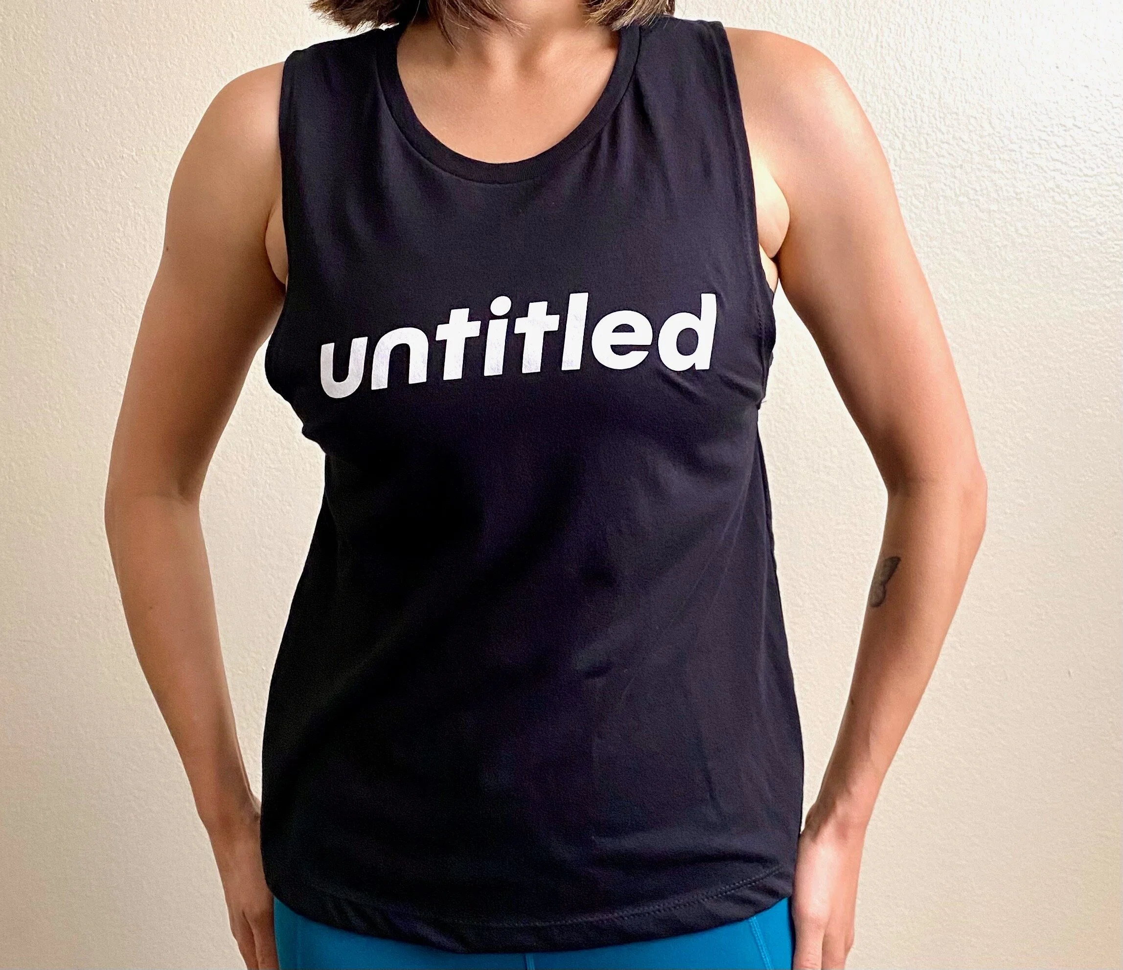 Jess-model-small-black-untitled-movement-muscle-tank-front-view.jpeg