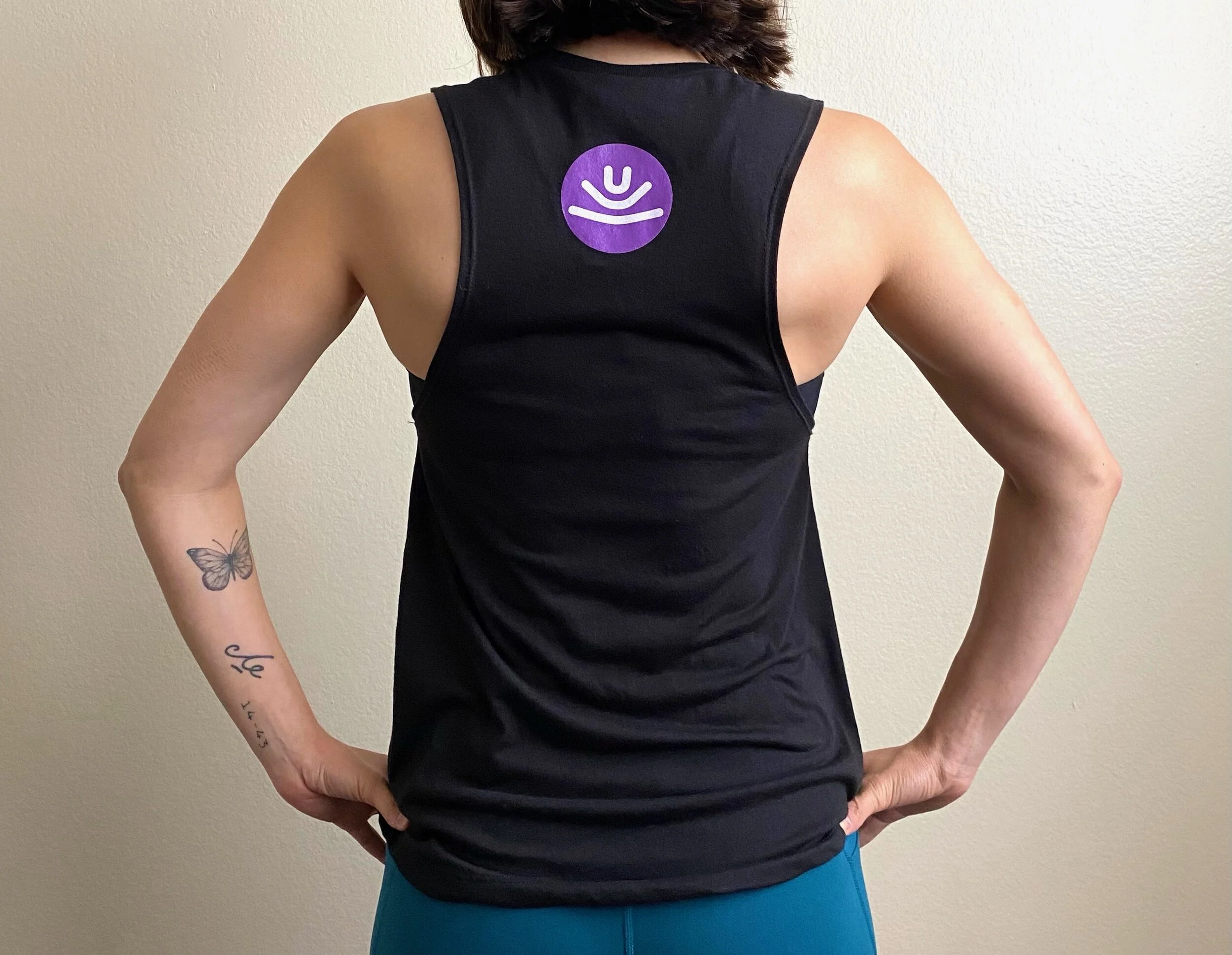 Jess-model-small-black-untitled-movement-muscle-tank-back-view.jpeg