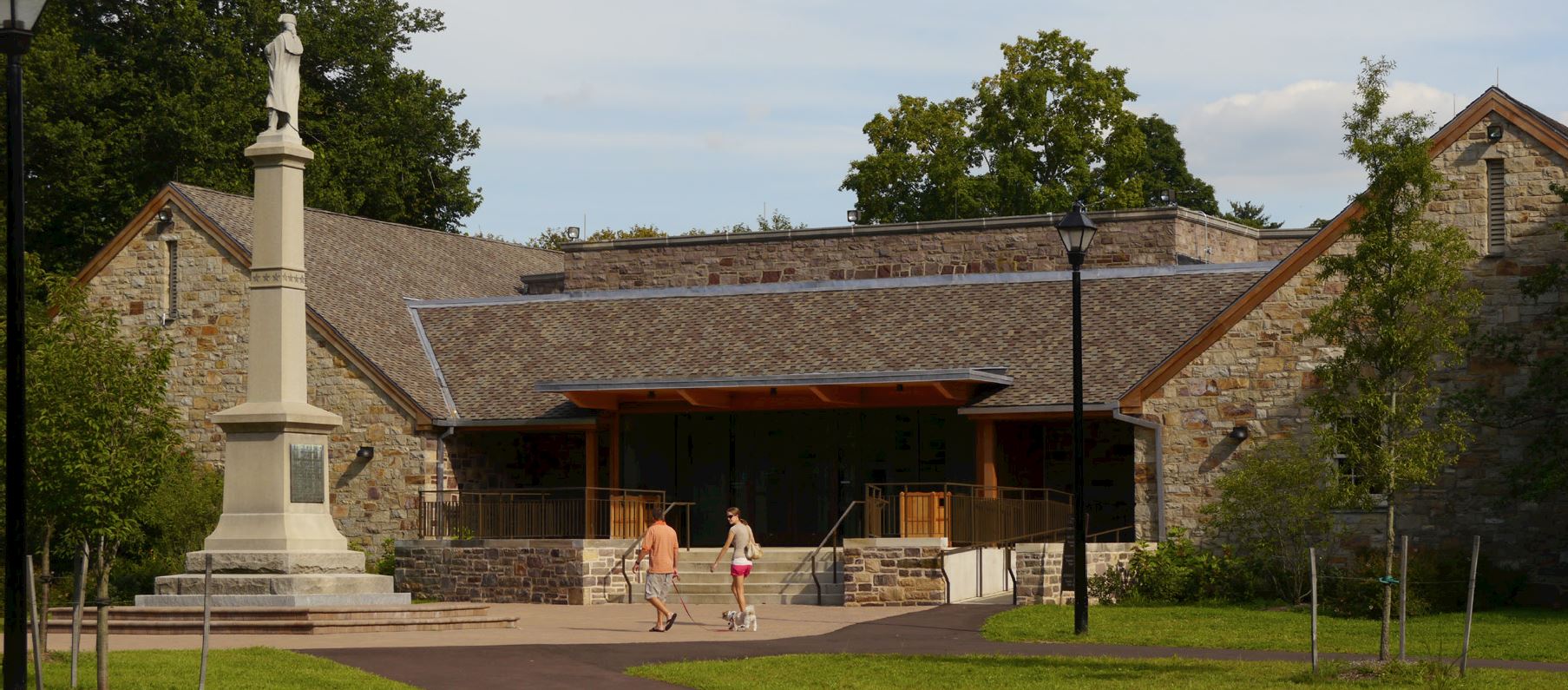Pennsylvania Historic and Museum Commission — Washington Crossing Visitor Center , Washington Crossing, PA We were commissioned by the Department of General Services and the Pennsylvania Historic and Museum Commission to transform a 23,000 SF outdated and deteriorating facility into a contemporary center to educate visitors and tell the story of the historic crossing and the surrounding 18th-century village of Taylorsville. The project included: landscape design, integration of environmentally-controlled artifact storage, new environmentally responsible geothermal building systems, orientation and exhibit spaces, classrooms, an auditorium, and bookstore.