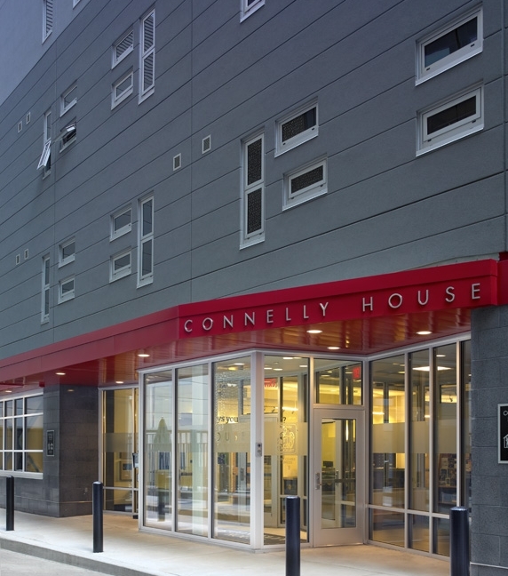 Project HOME, Bethesda Project, St. John the Evangelist Church — Connelly House , Philadelphia, PA Our team, working closely with both organizations and St. John the Evangelist Church, designed an eight-story, multi-use building that provides 79 units of affordable, supportive housing for formerly homeless adults, as well as facilities for their respective programs and a new, larger Parish Center for the church. Connelly House features 24 single-room occupancy units, 55 efficiency apartments, communal spaces for socializing and dining, supportive services office and conference spaces, a computer lab, an exercise room, tenant storage, a laundry room, two lower terraces, and a roof terrace with a green roof. The Parish Center includes offices, conference space, and a large sub-dividable community room that can accommodate a variety of activities and events. The project’s location on a site served only by narrow streets posed challenges for the builder, with attendant costs. To help offset construction costs, the project team collaborated to create interesting massing and texture in combination with structural simplicity for the building’s facade; employed pre-fabricated exterior wall panels; and used a pattern of irregularly distributed windows to create visual interest without great expenditure. Sustainability was integral to the design process from the beginning when the project team attained the goal of becoming the first LEED Gold high-rise supportive housing facility in Philadelphia.