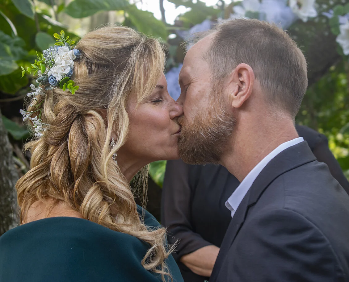 Couple kissing in outdoor wedding at Emerson Pointe