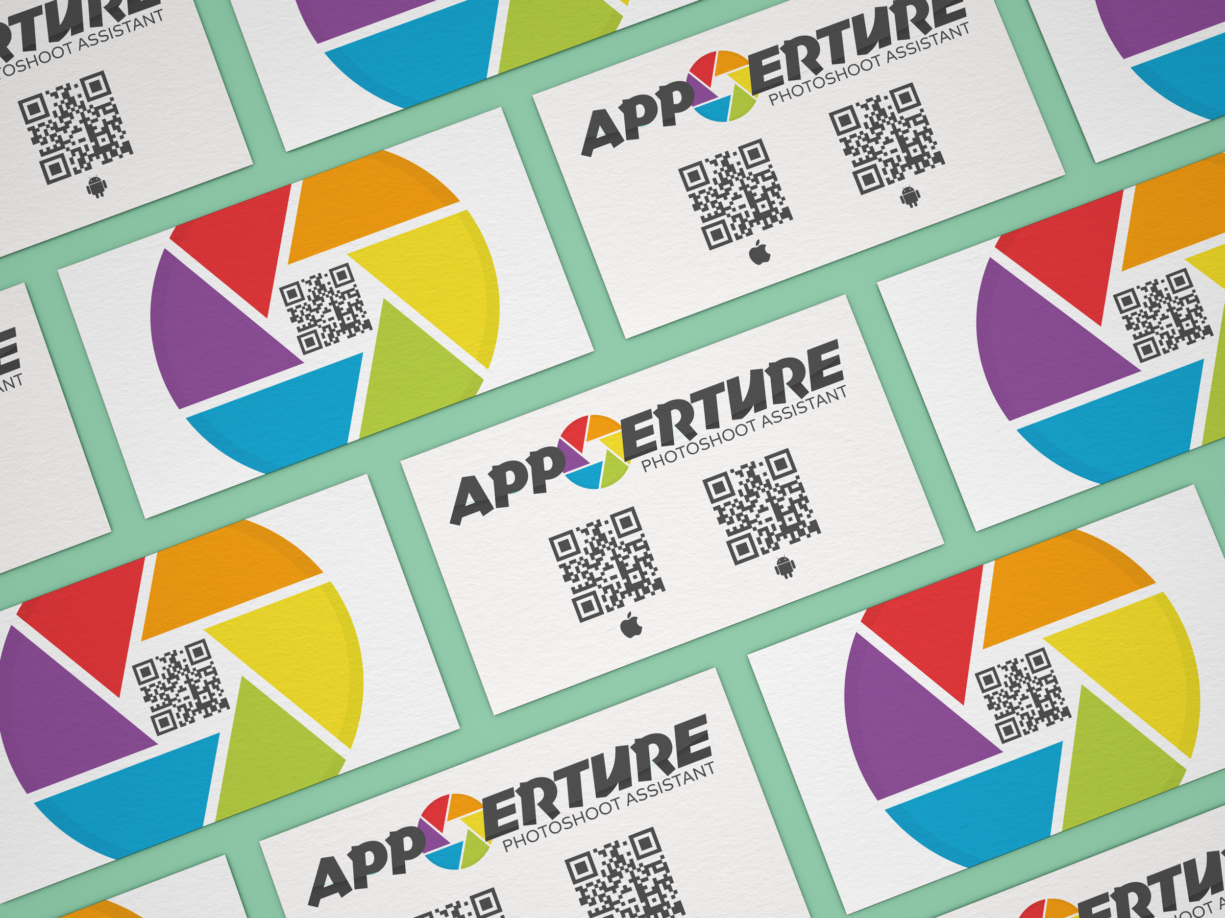 Business cards arranged in a pattern with colorful pie chart designs, QR codes, and the text 'APPER TURE PHOTOSHOOT ASSISTANT' with icons for Android and Apple.