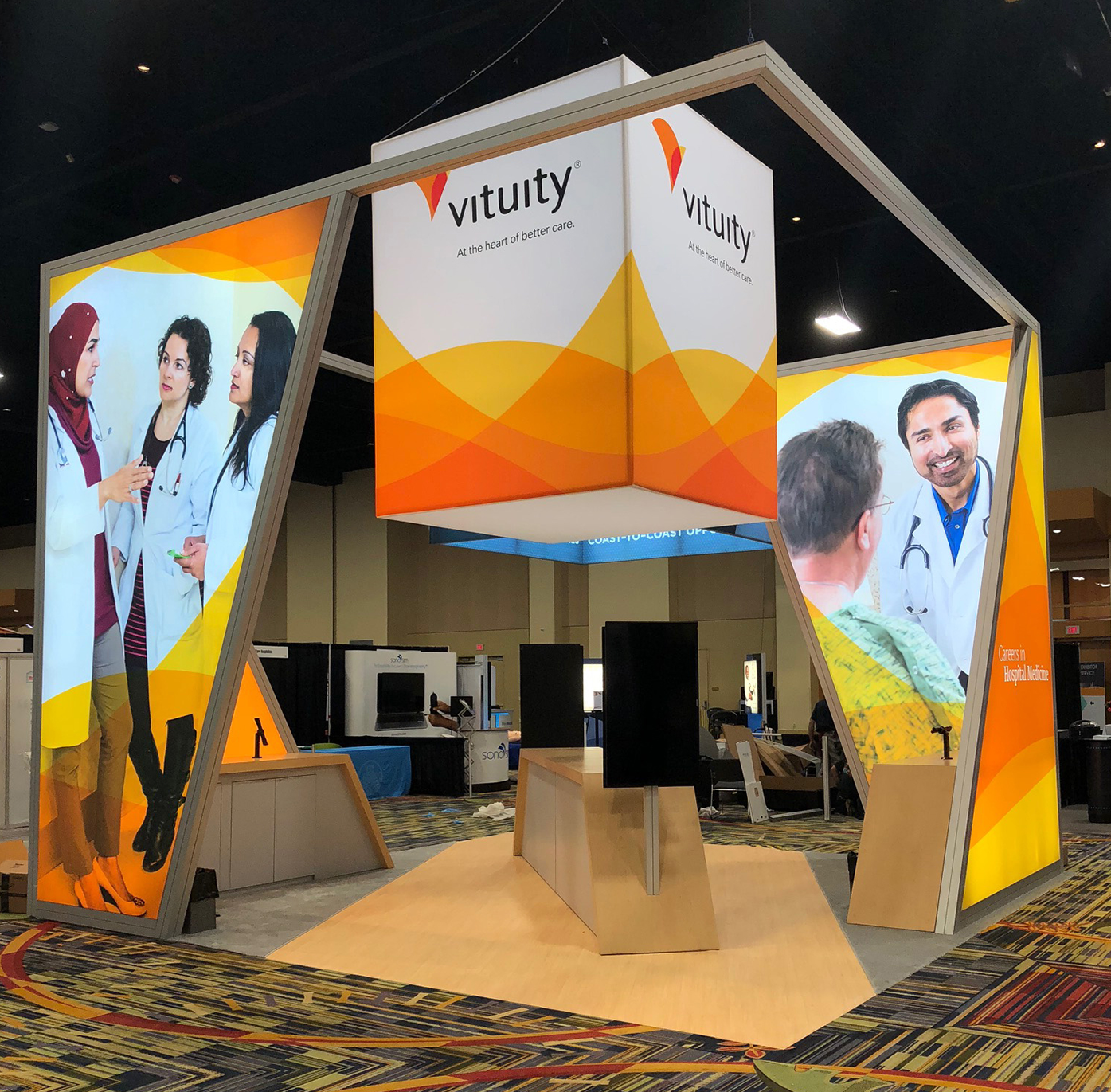 As part of the rebranding effort, our presence at trade shows needed to be reflective of Vituity’s new brand. Initial use case was at the Society of Hospitalist Medicine conference. Above is initial set up in Las Vegas. For this booth, I was art dir…