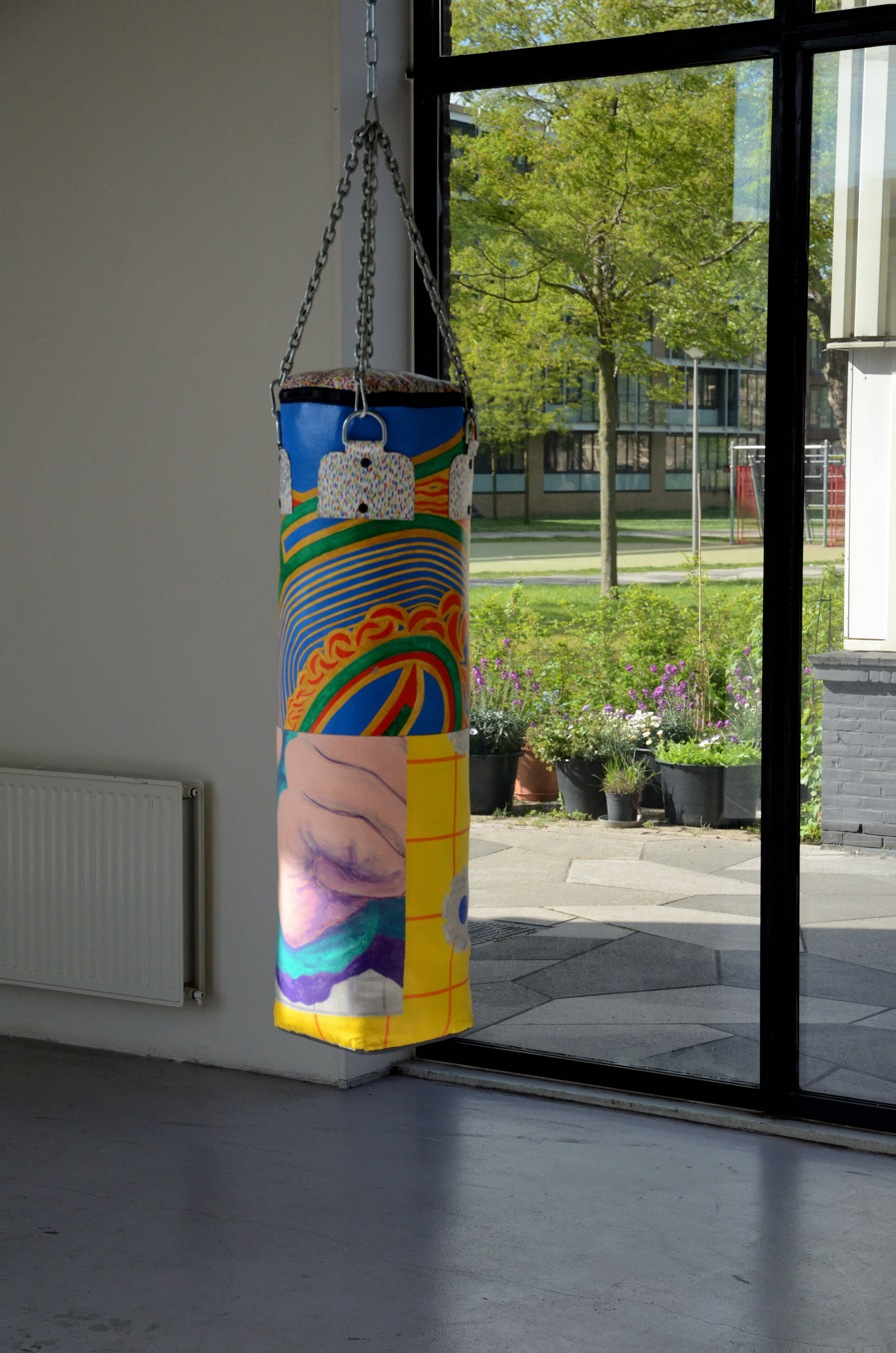 Out of Universal Dynamics, punching bag made from Smit's old paintings, ca.105x30cm