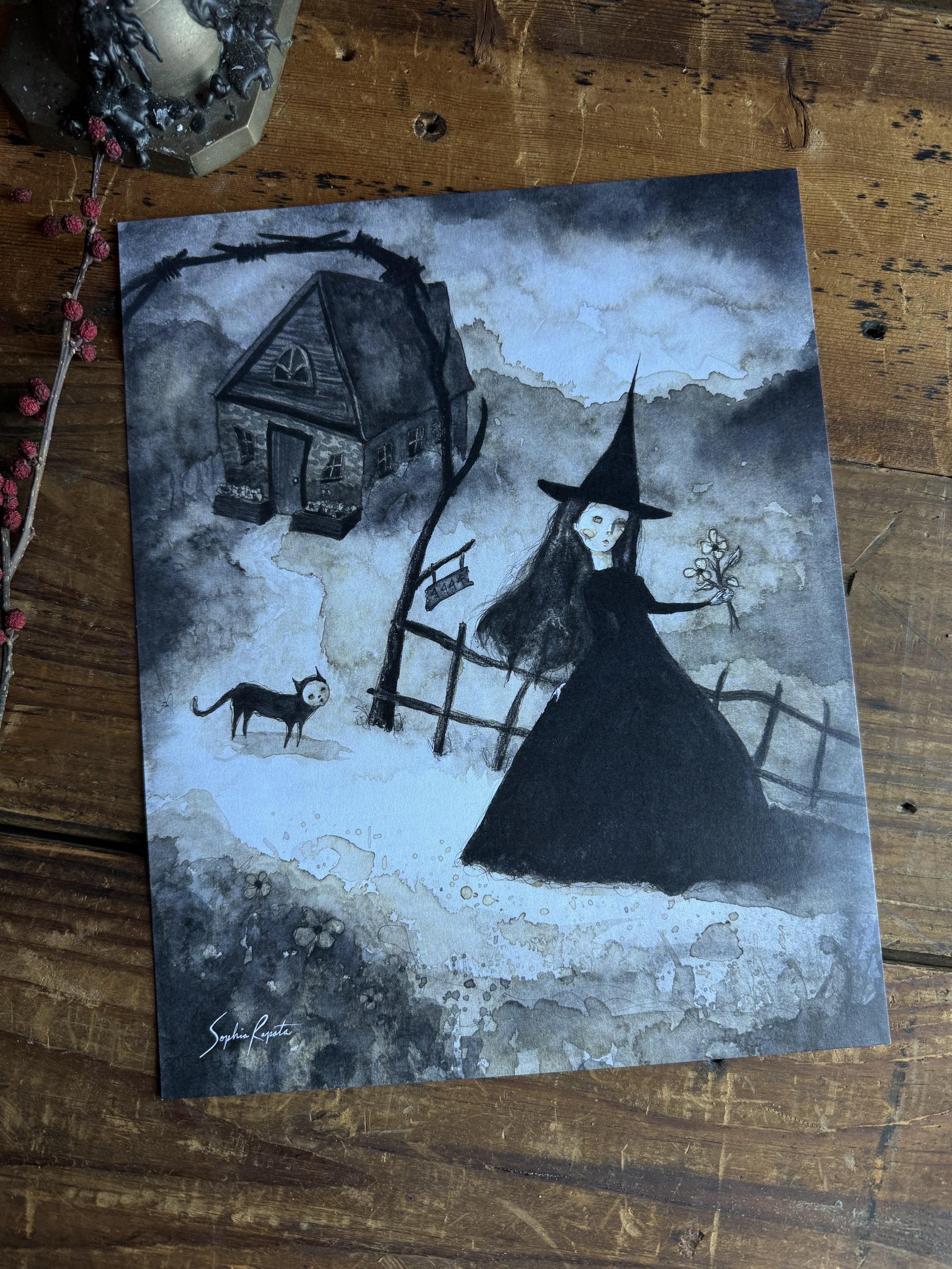 Print of a watercolor painting of a witch going to work or out for a stroll.