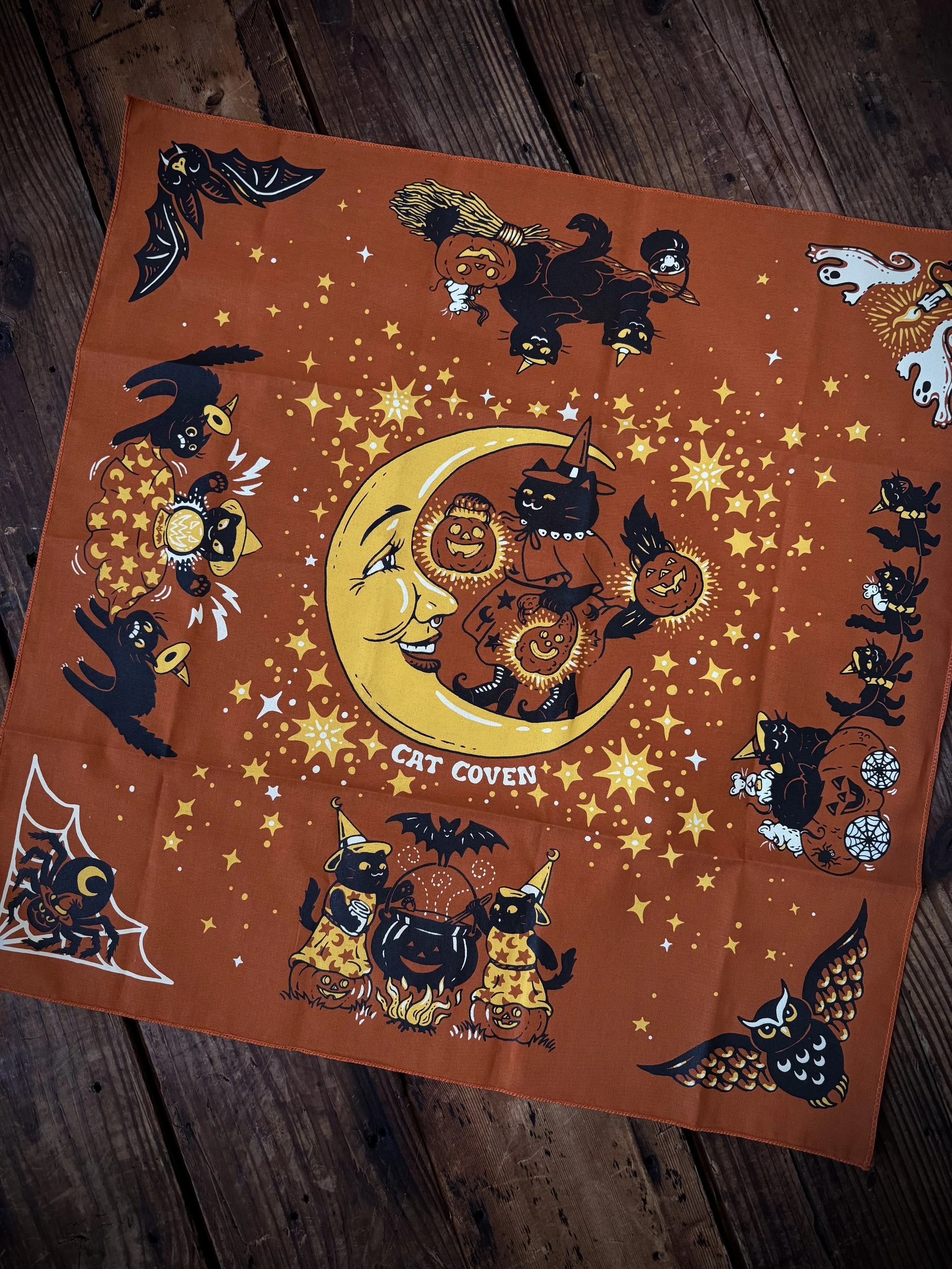 vintage halloween inspired black, orange, and yellow bandana with black cats and a crescent moon