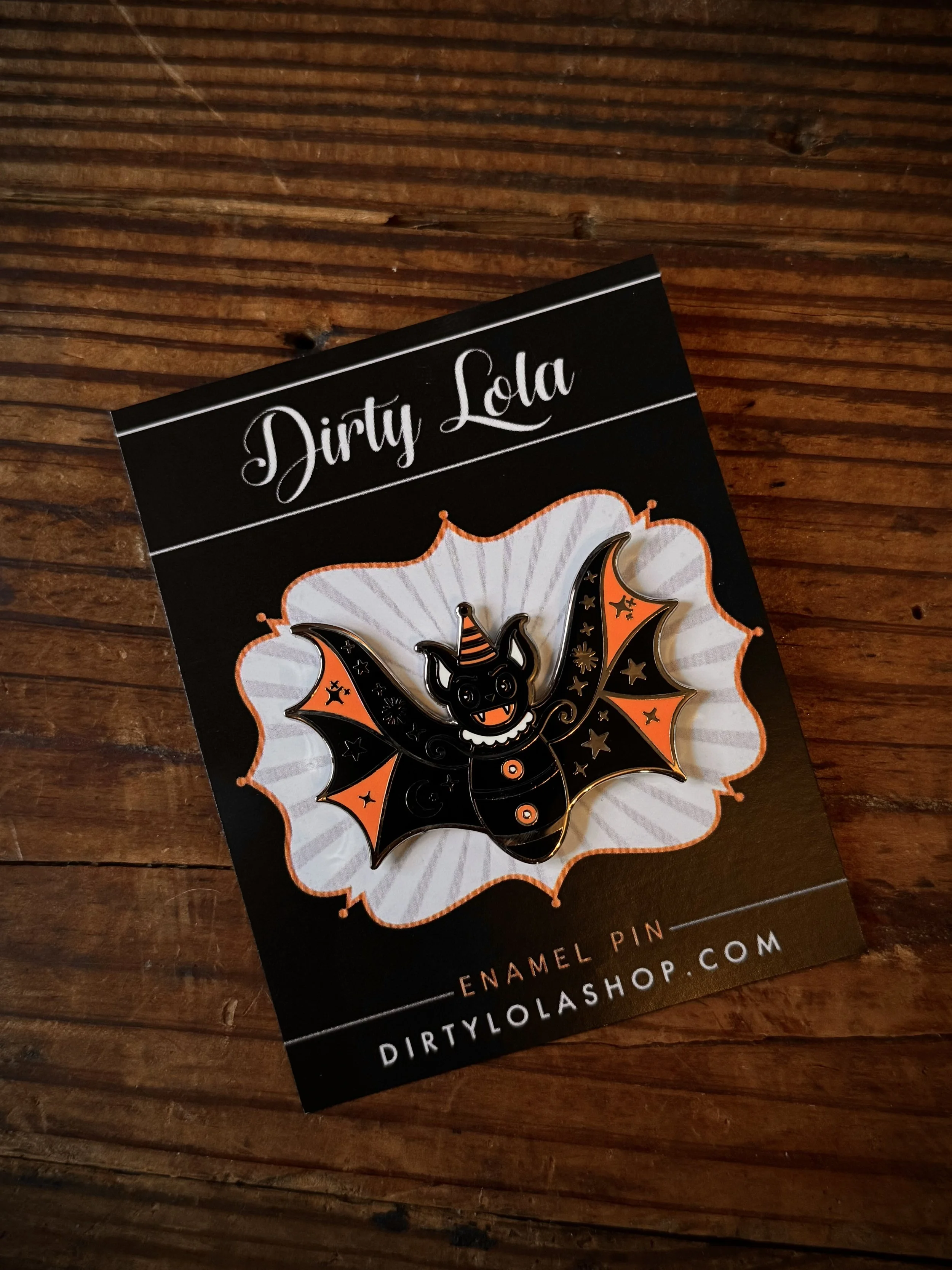 vintage halloween character inspired enamel pins: frankenstein, swamp thing, a halloween bat, and a black cat