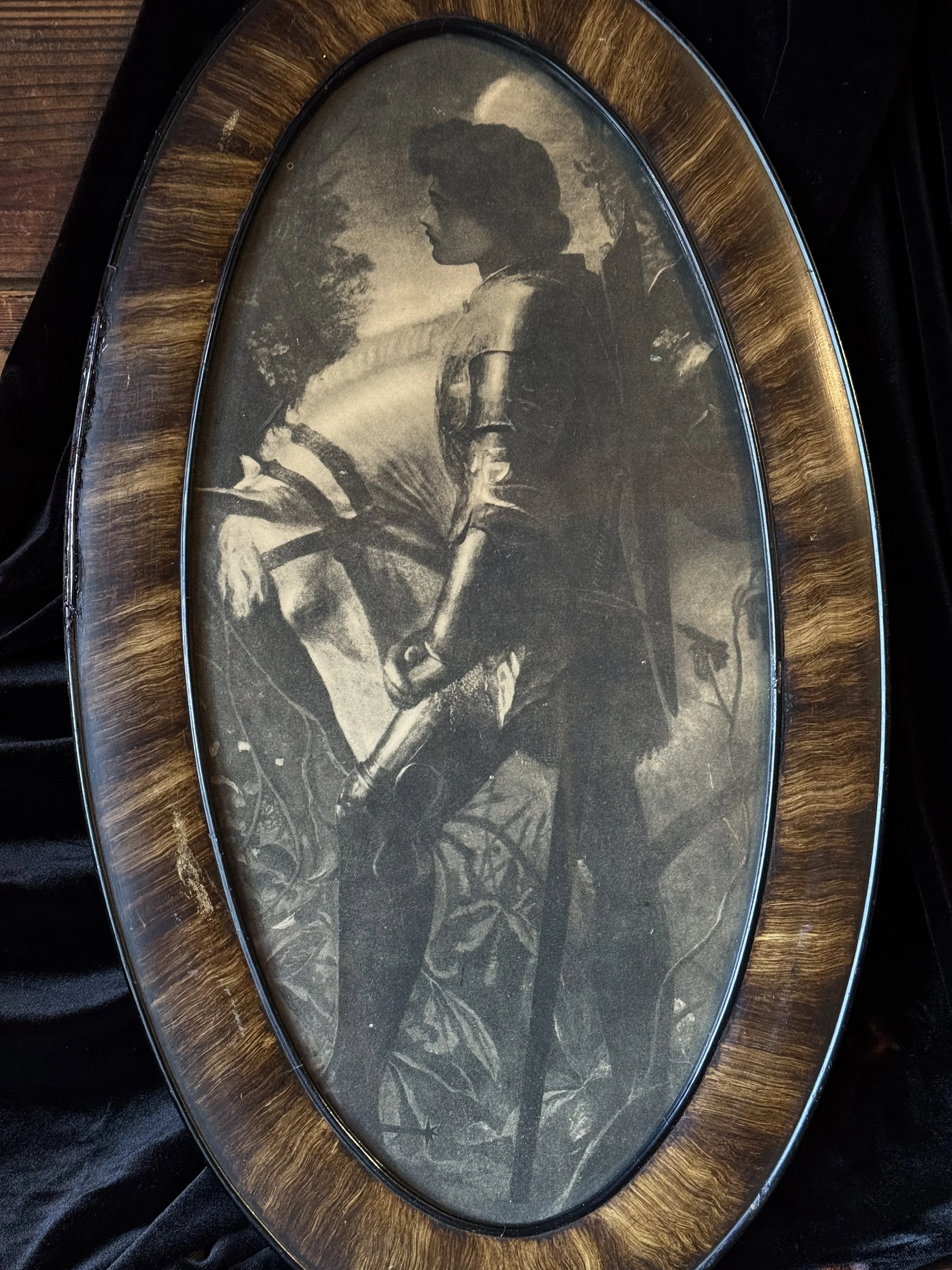 antique framed black and white print of joan of arc in an oval wood frame