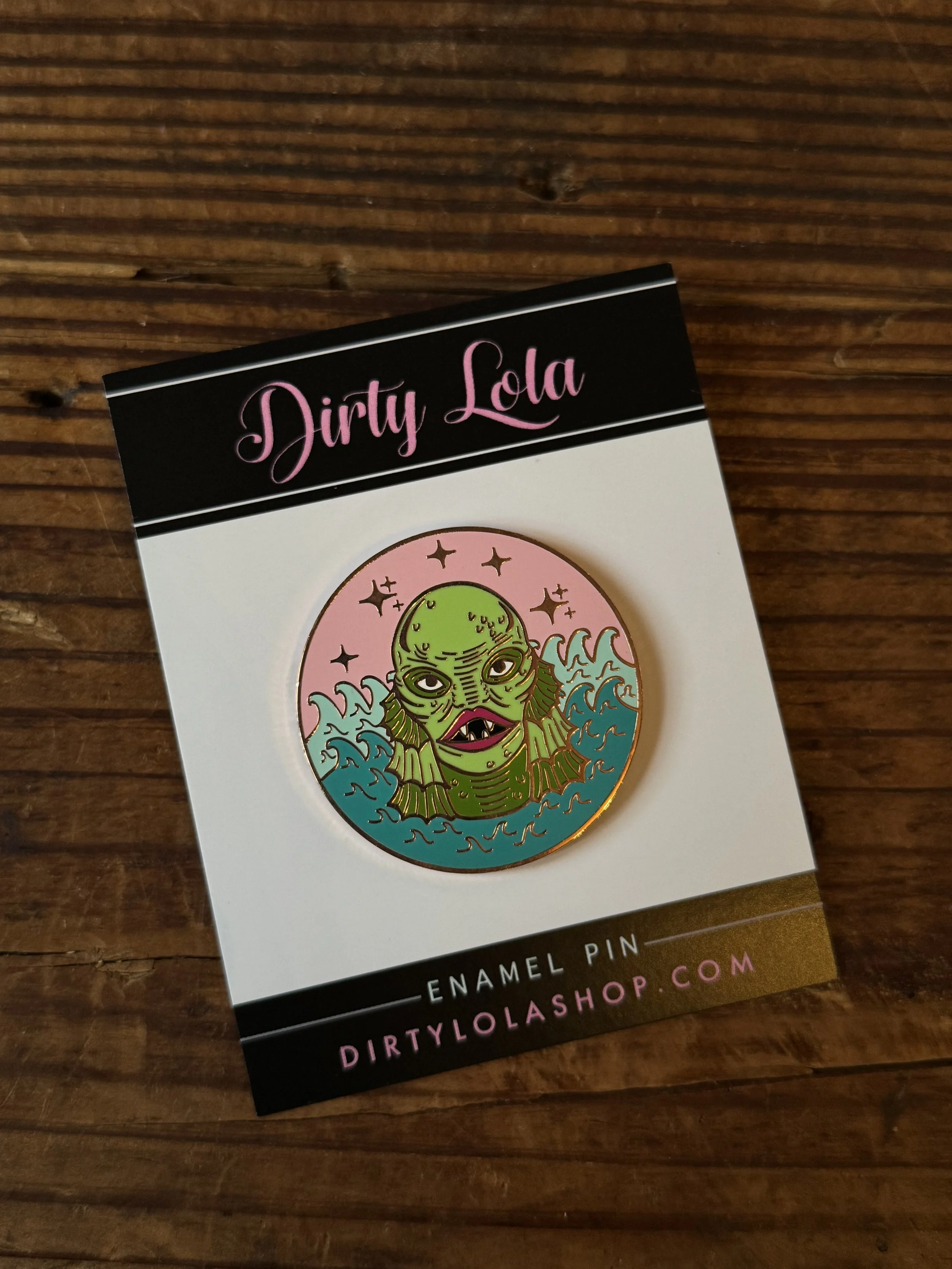 vintage halloween character inspired enamel pins: frankenstein, swamp thing, a halloween bat, and a black cat
