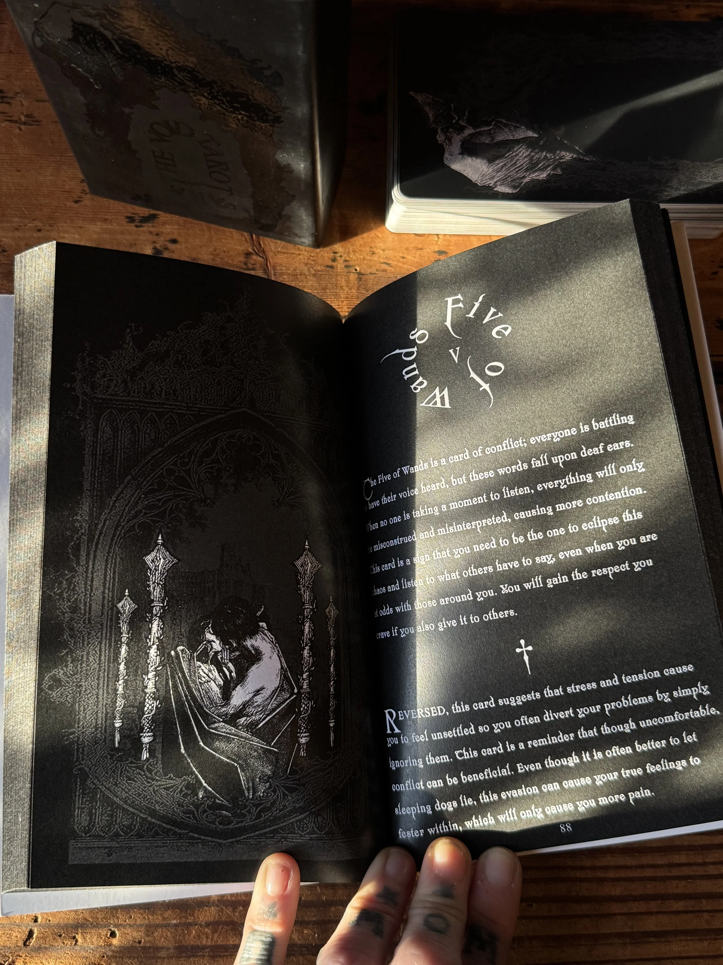 a black, red, and white collage-style tarot deck created by Sarai Nissan