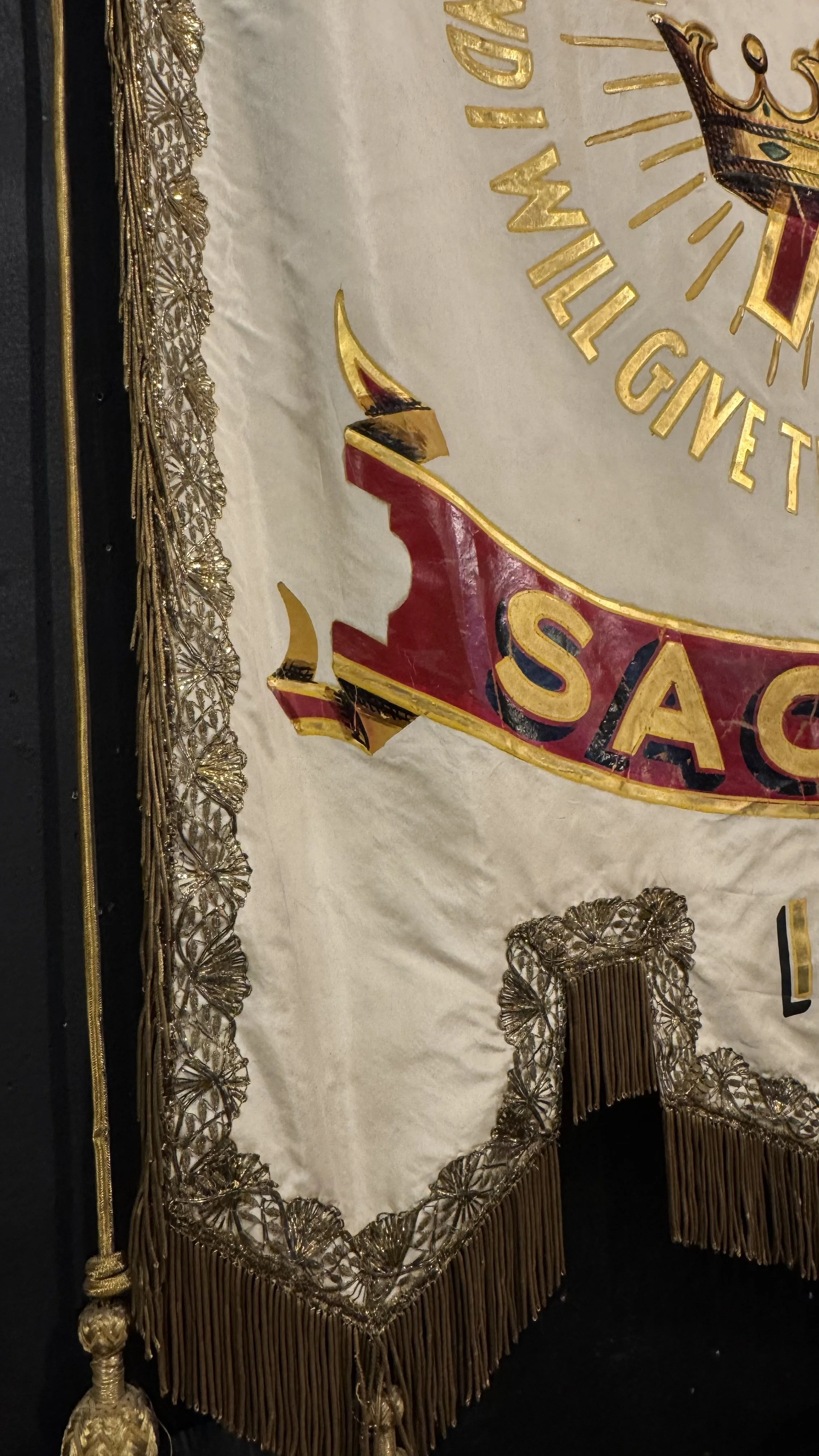 Sac City Iowa antique lodge banner with red and gold detail and crown imagery