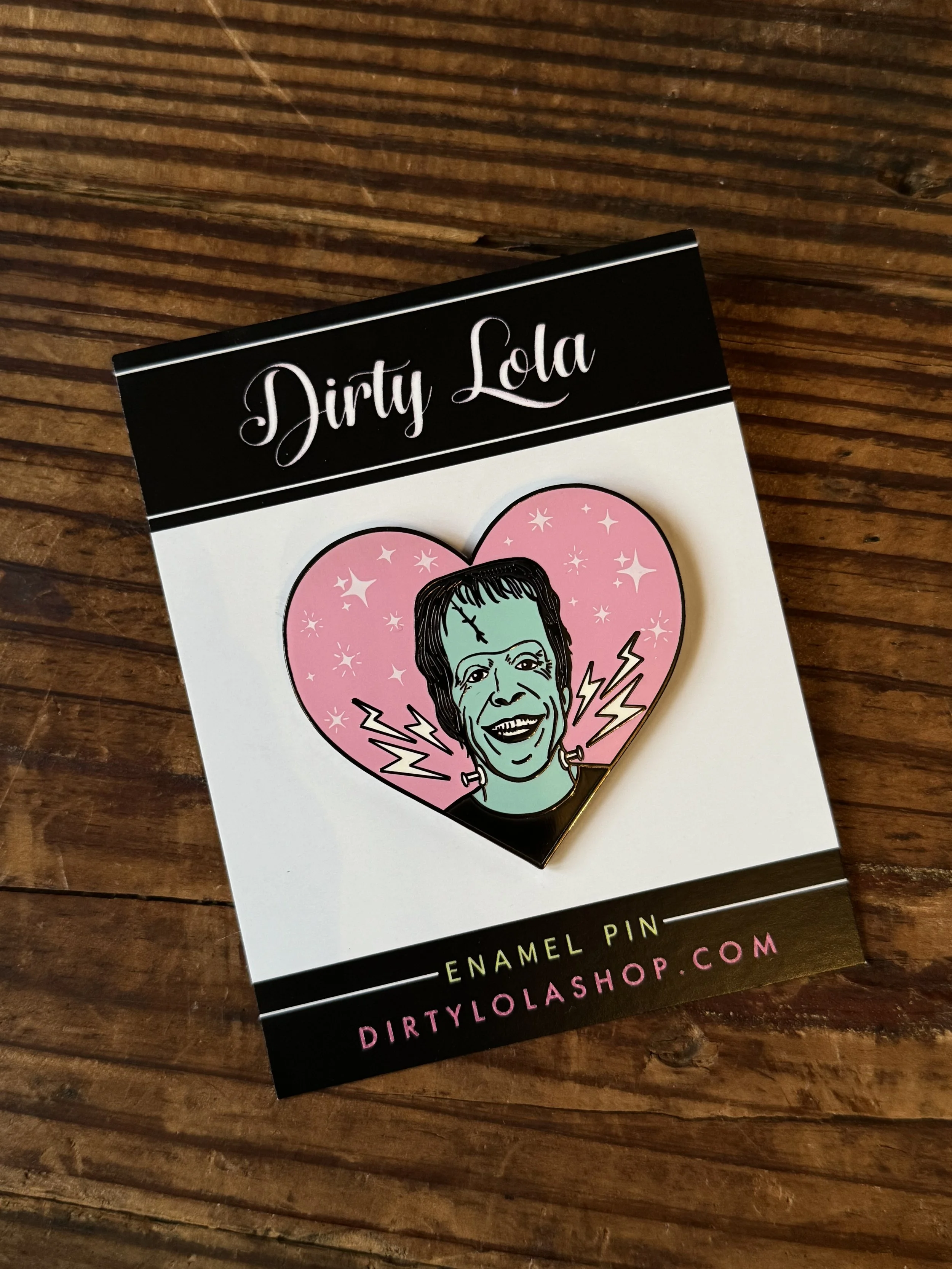 vintage halloween character inspired enamel pins: frankenstein, swamp thing, a halloween bat, and a black cat