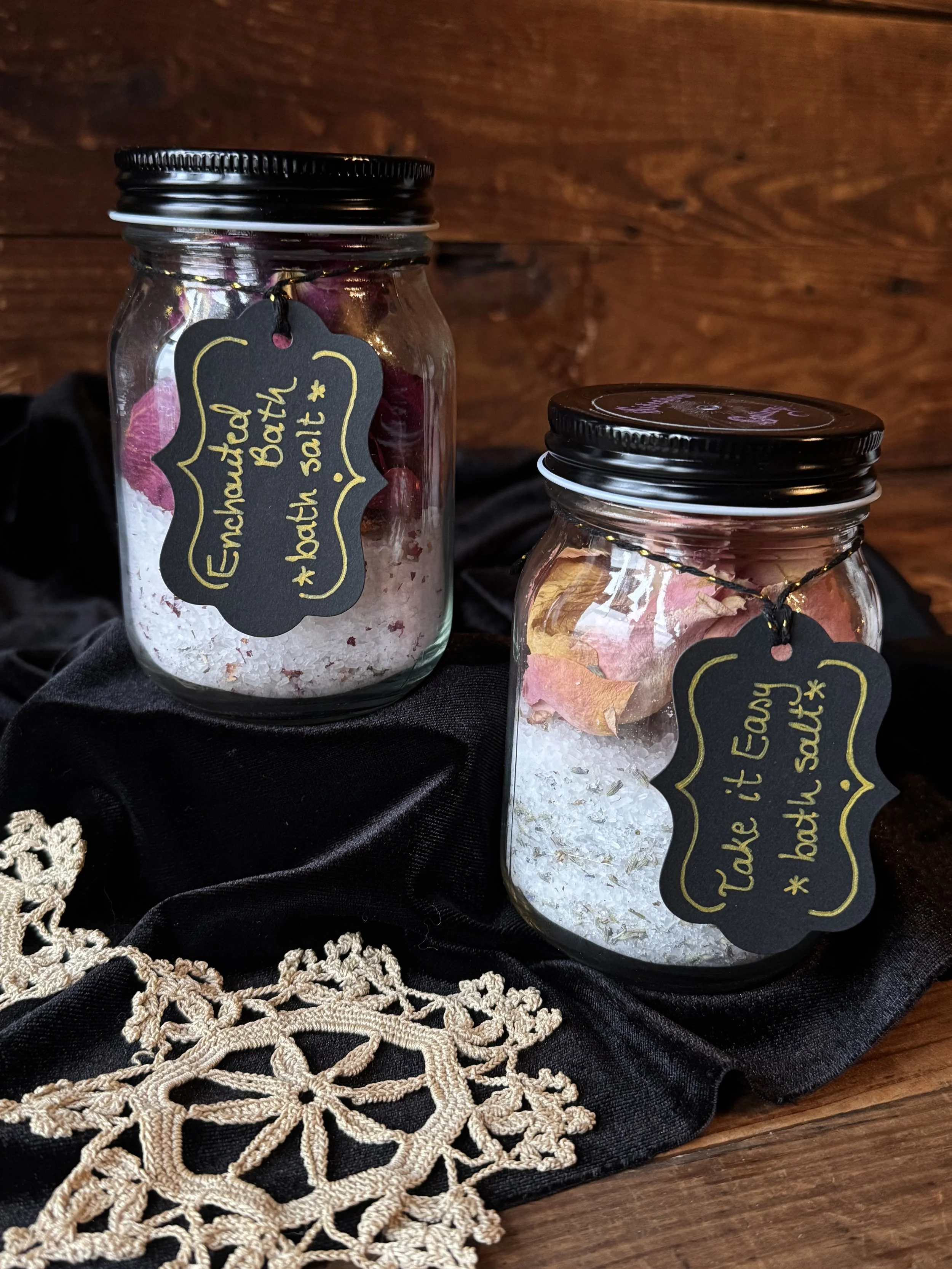in-house created jars of bath salts with rose petals, essential oils, and epsom salt