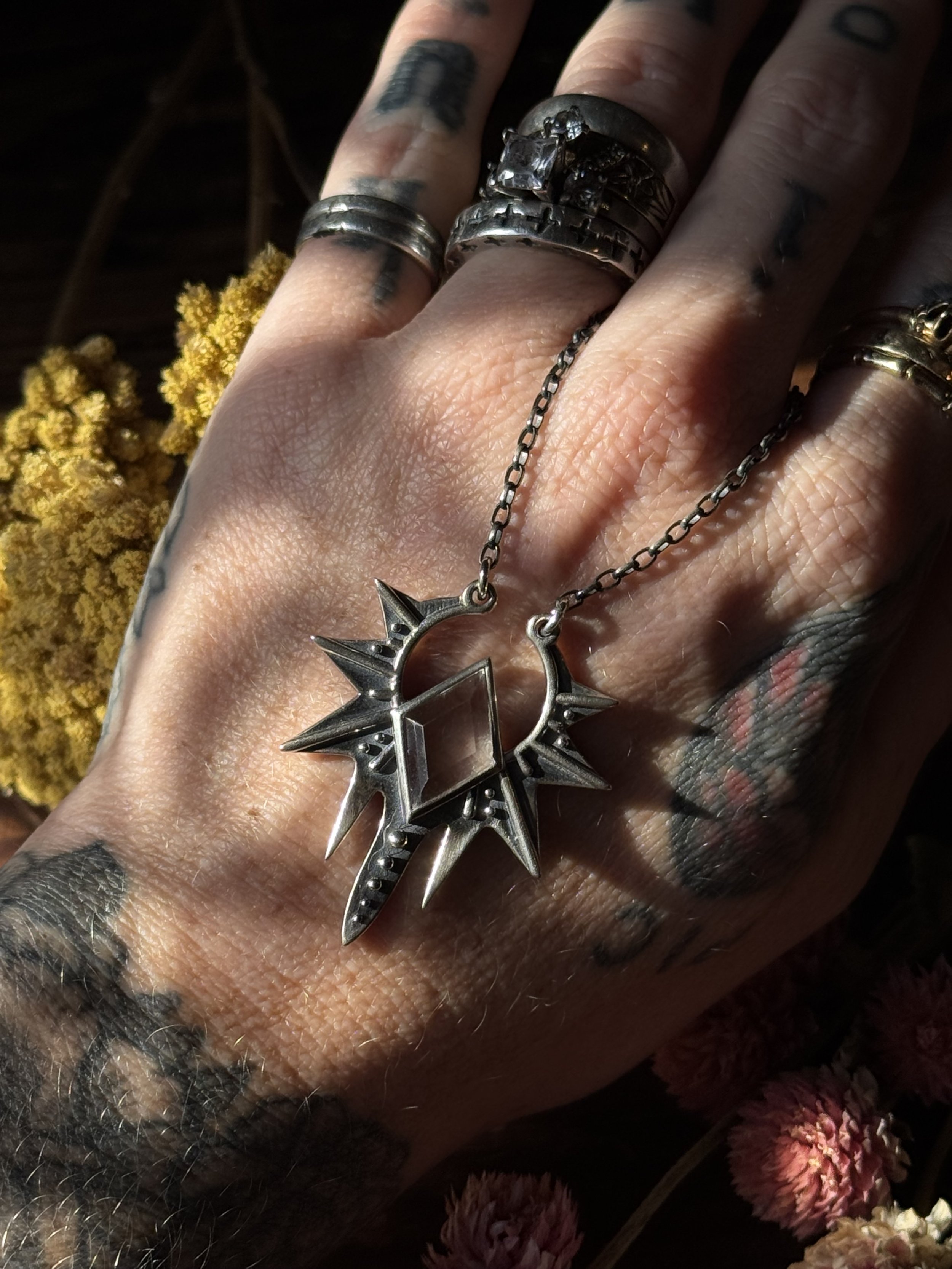 Sterling silver Starling Necklace made by Acid Queen with a clear quartz stone