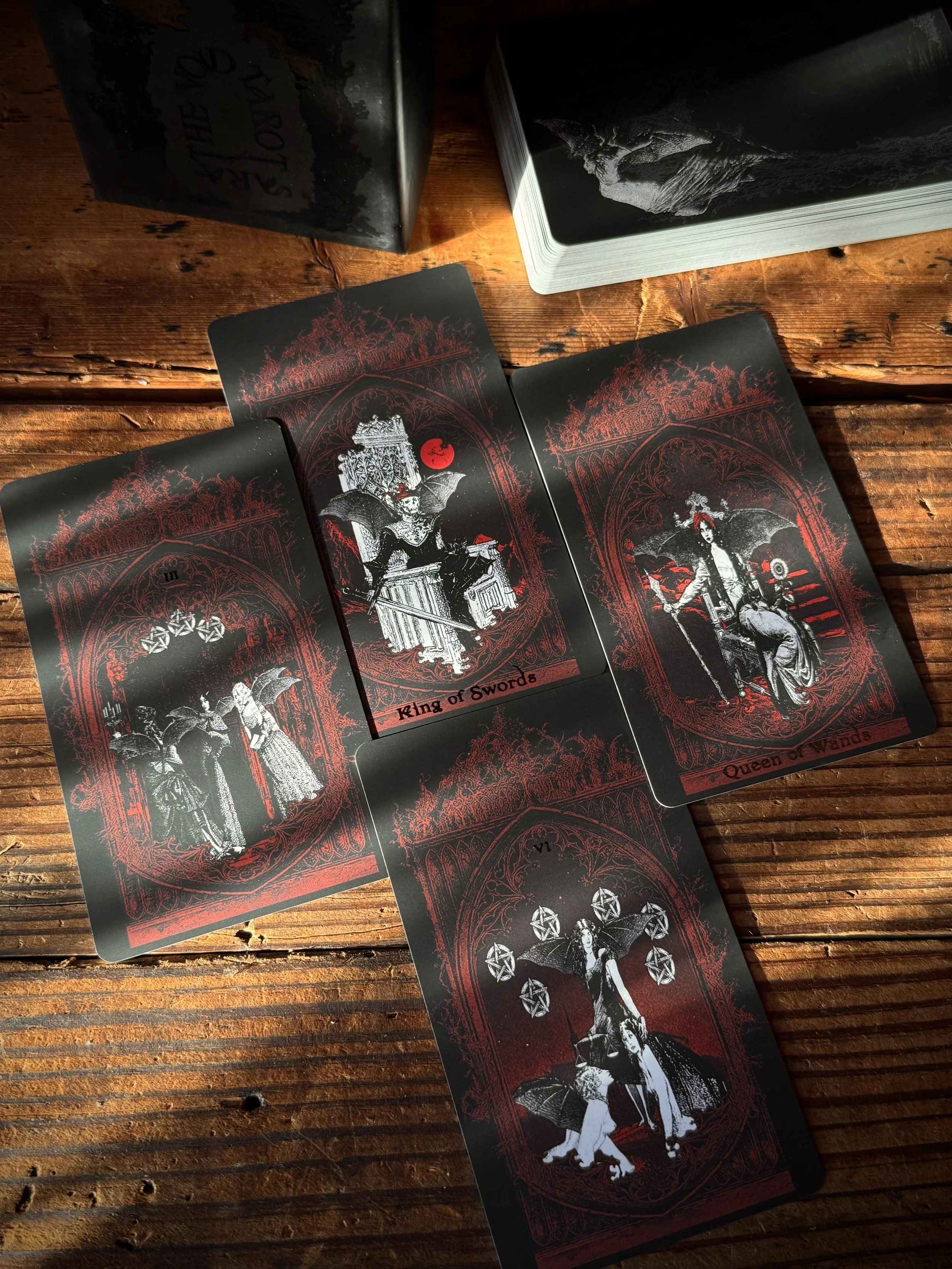 a black, red, and white collage-style tarot deck created by Sarai Nissan