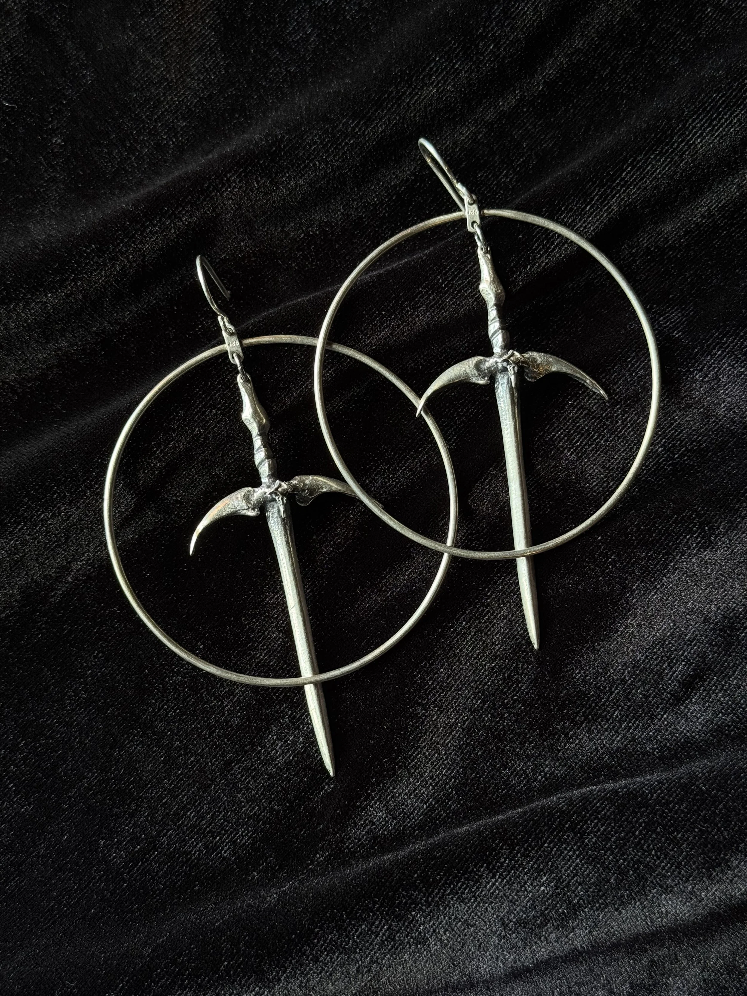Sterling silver dagger and hoop earrings by Acid Queen Jewelry