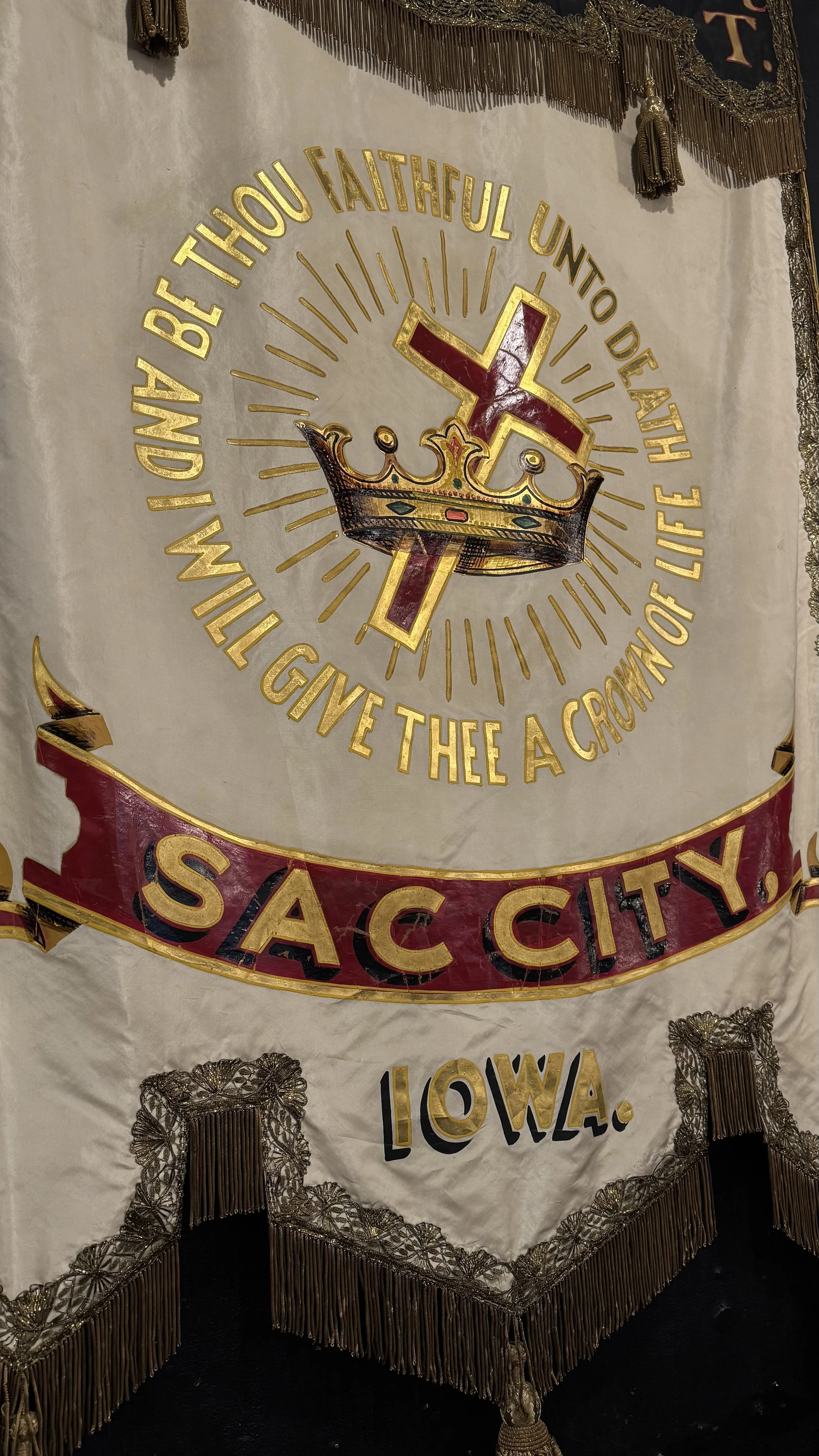 Sac City Iowa antique lodge banner with red and gold detail and crown imagery
