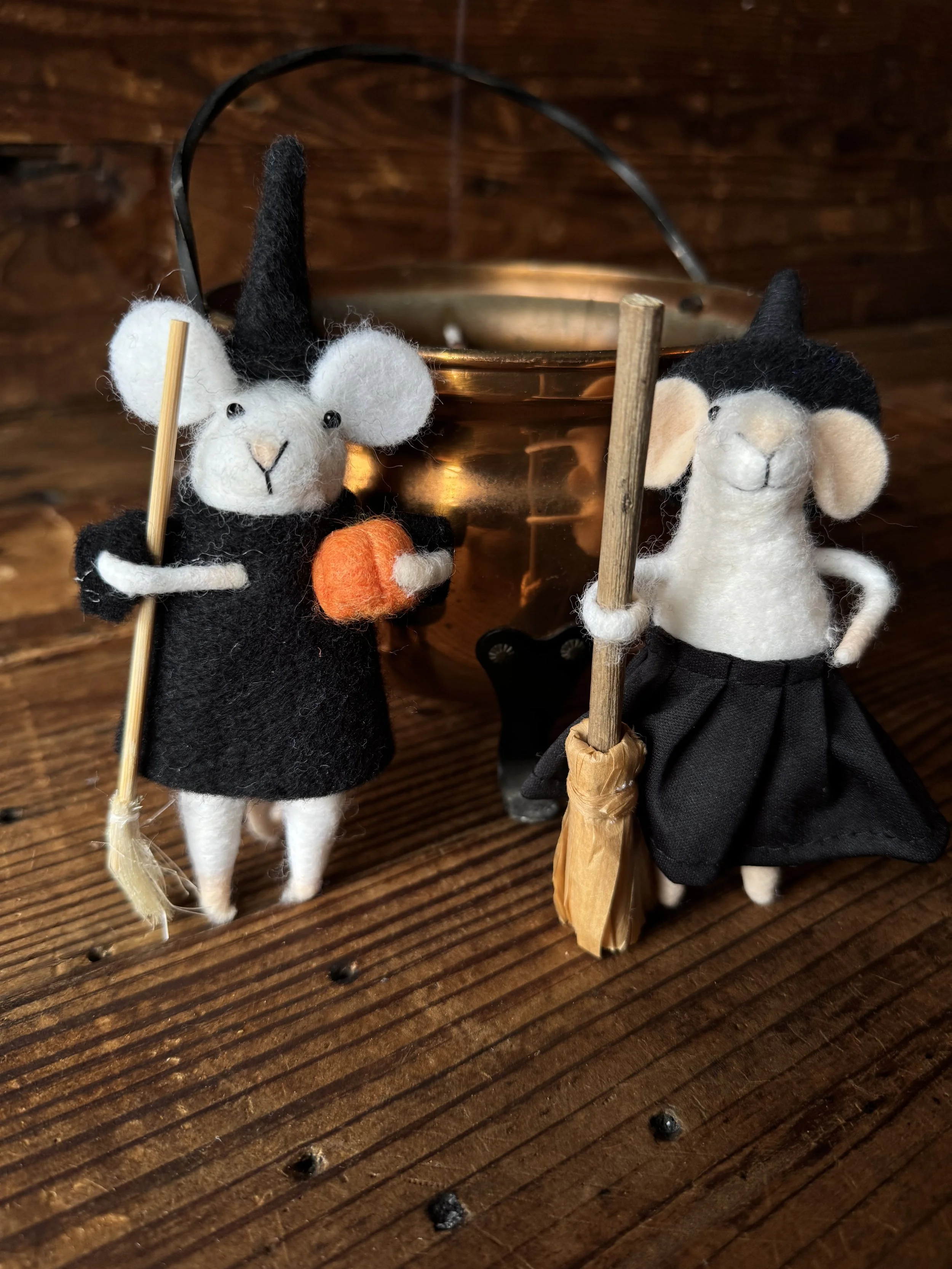 adorable felted mouse witch with a tiny witch hat and a tiny broom
