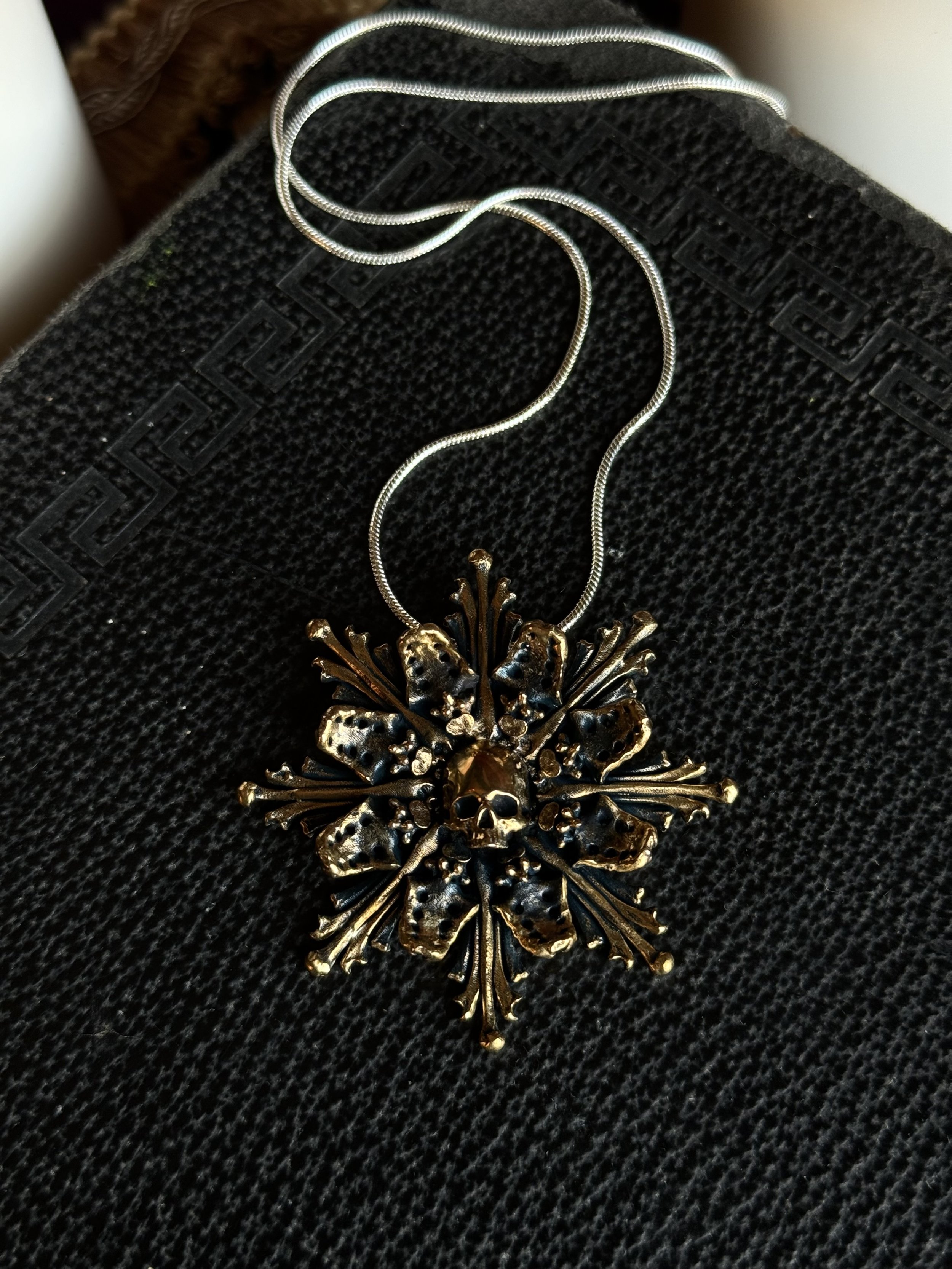 Brass catacomb pendant necklace.