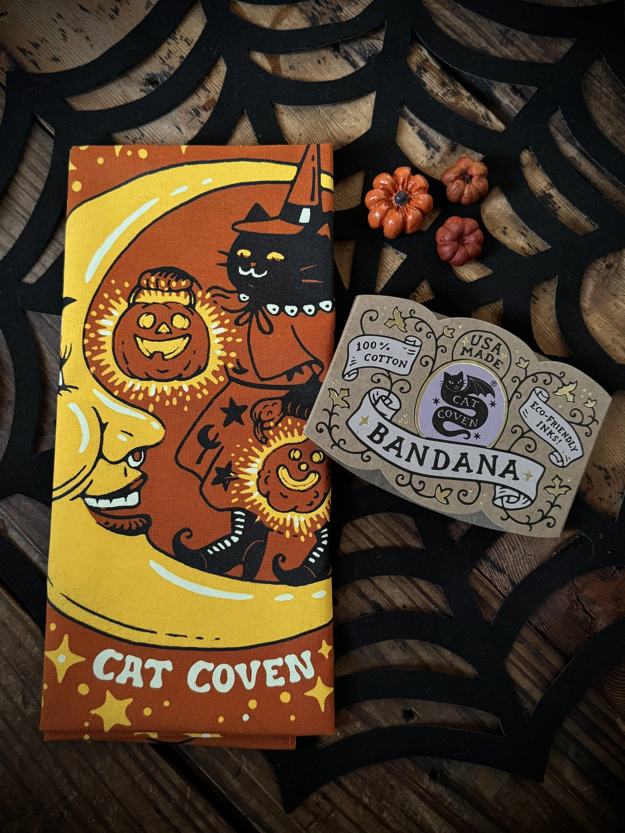 vintage halloween inspired black, orange, and yellow bandana with black cats and a crescent moon
