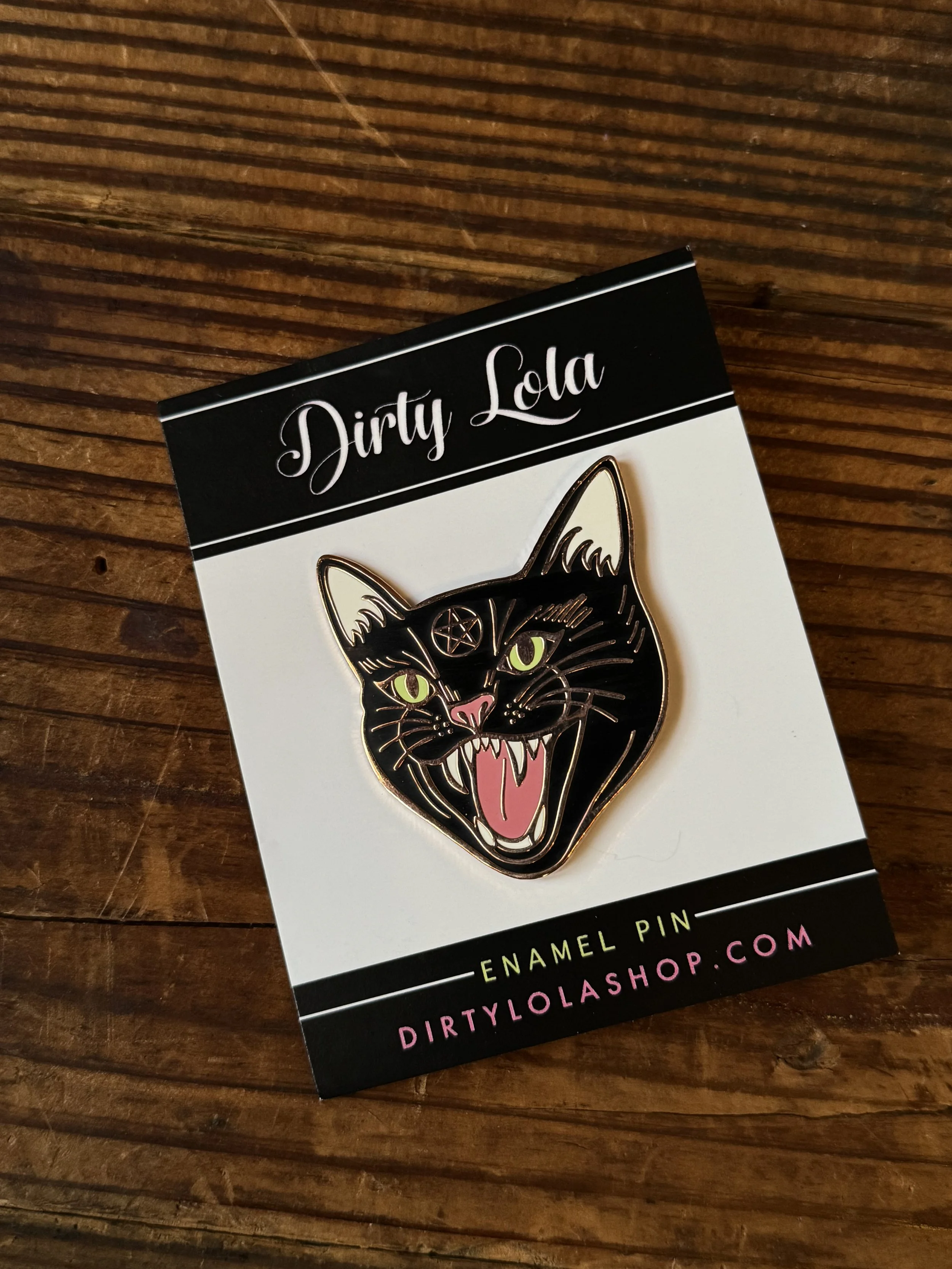 vintage halloween character inspired enamel pins: frankenstein, swamp thing, a halloween bat, and a black cat