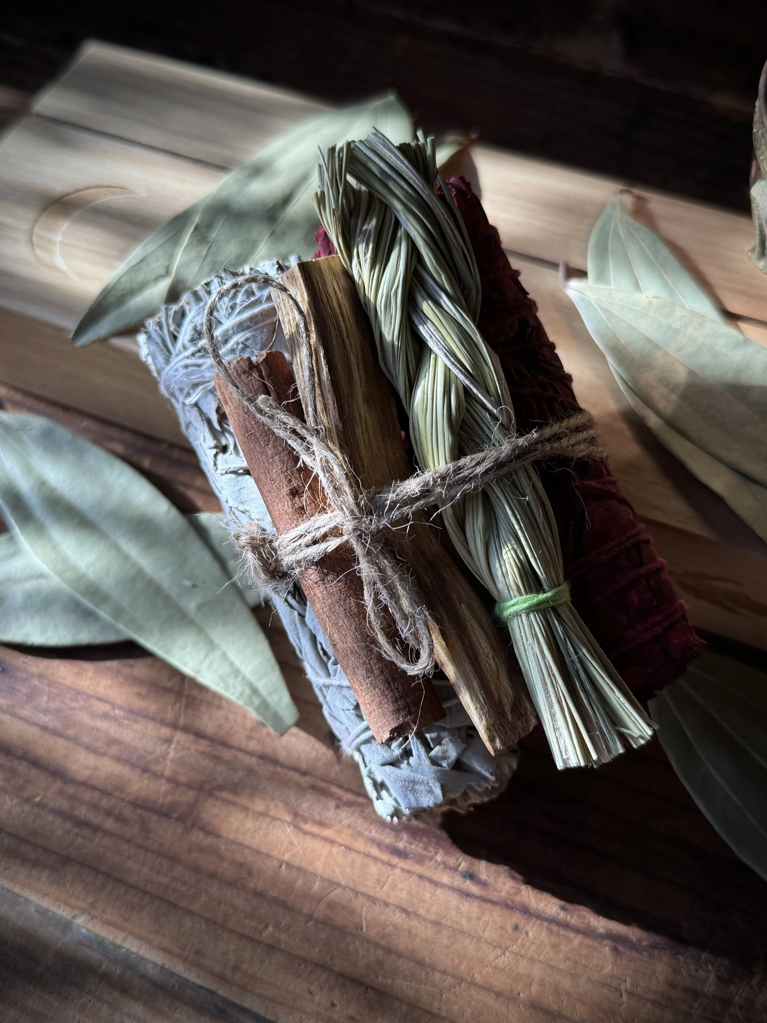burn bundle created at sideshow with white sage, dragon's blood, sweet grass, palo santo, and cinnamon