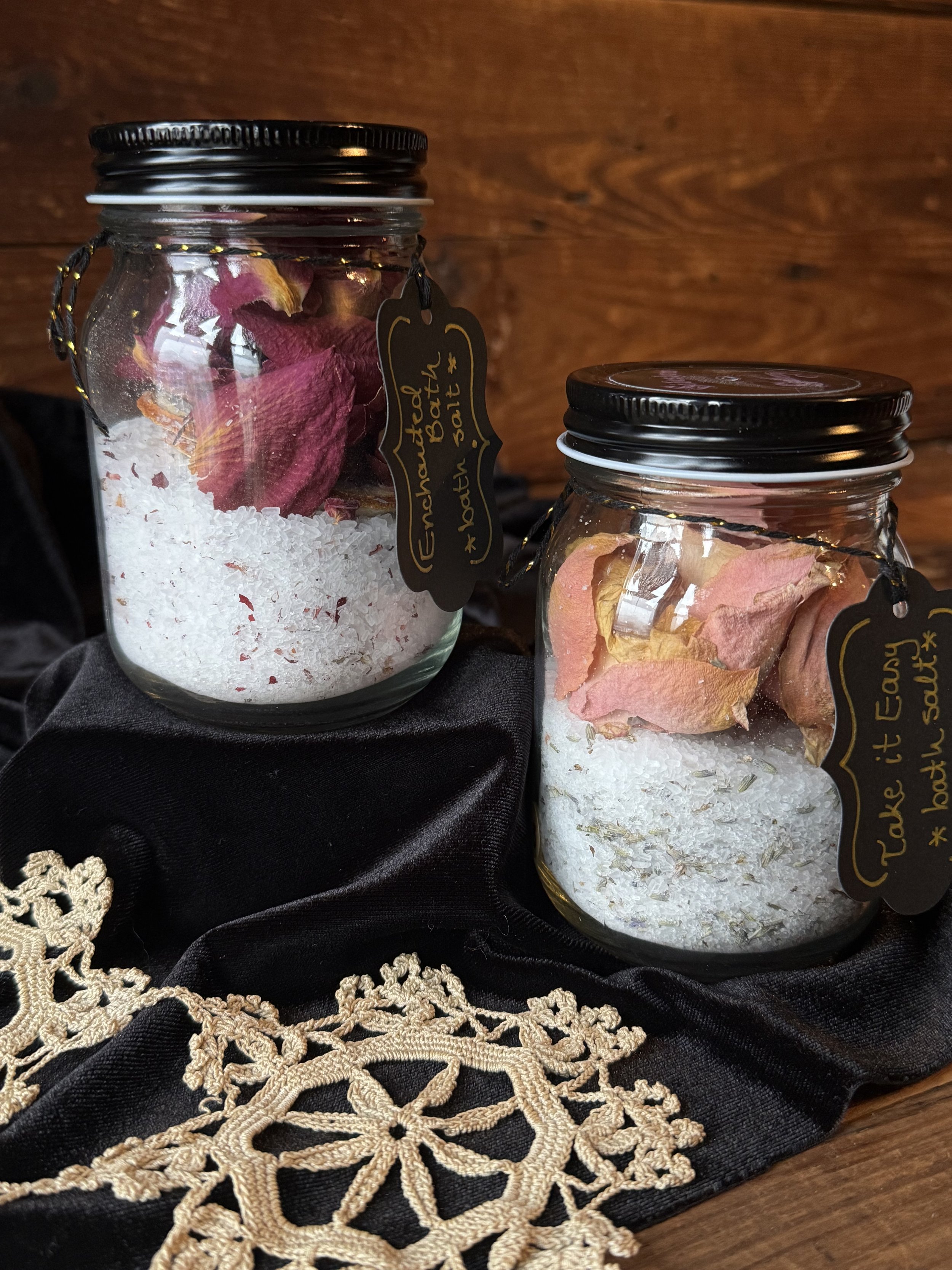 in-house created jars of bath salts with rose petals, essential oils, and epsom salt