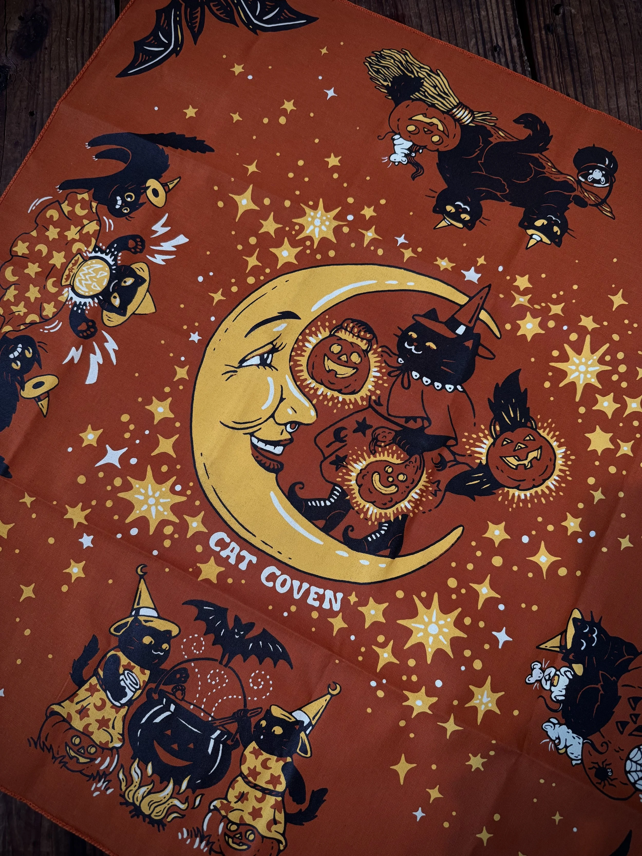 vintage halloween inspired black, orange, and yellow bandana with black cats and a crescent moon