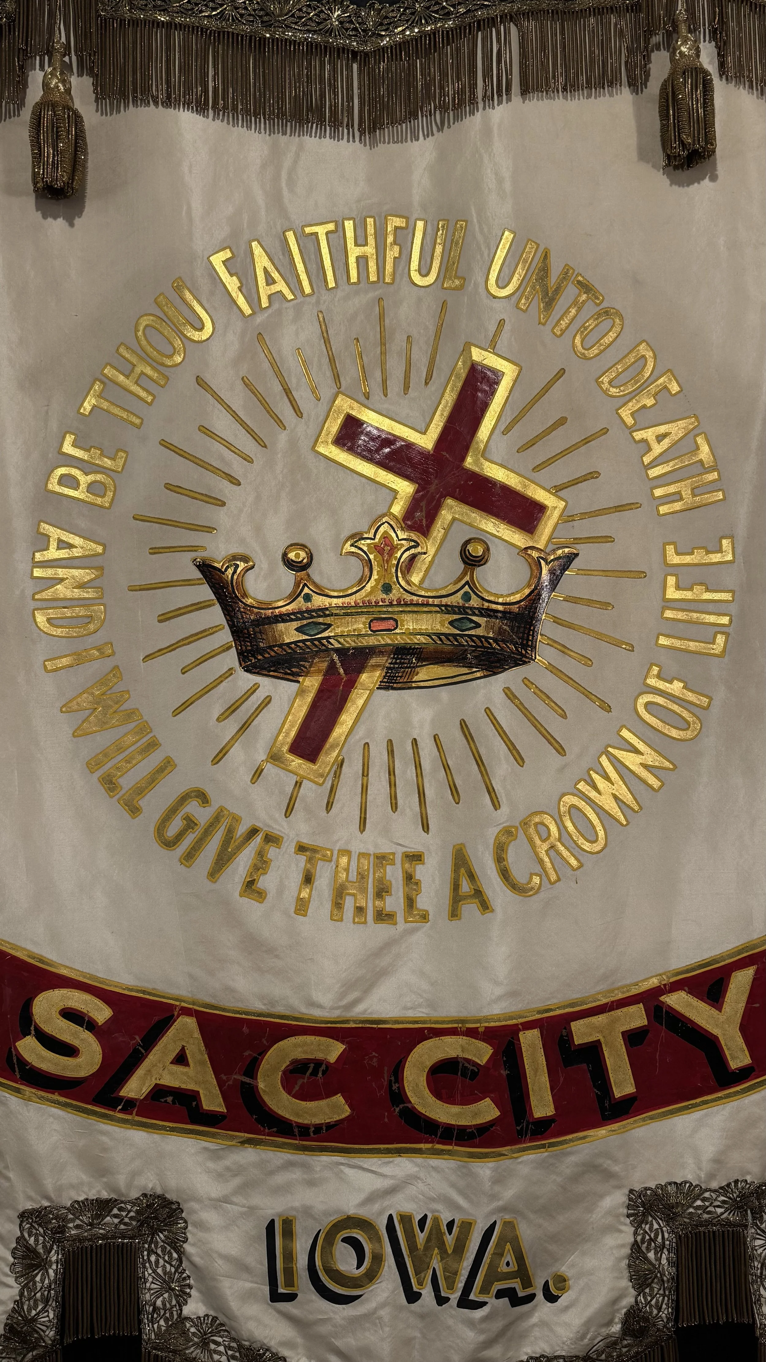 Sac City Iowa antique lodge banner with red and gold detail and crown imagery