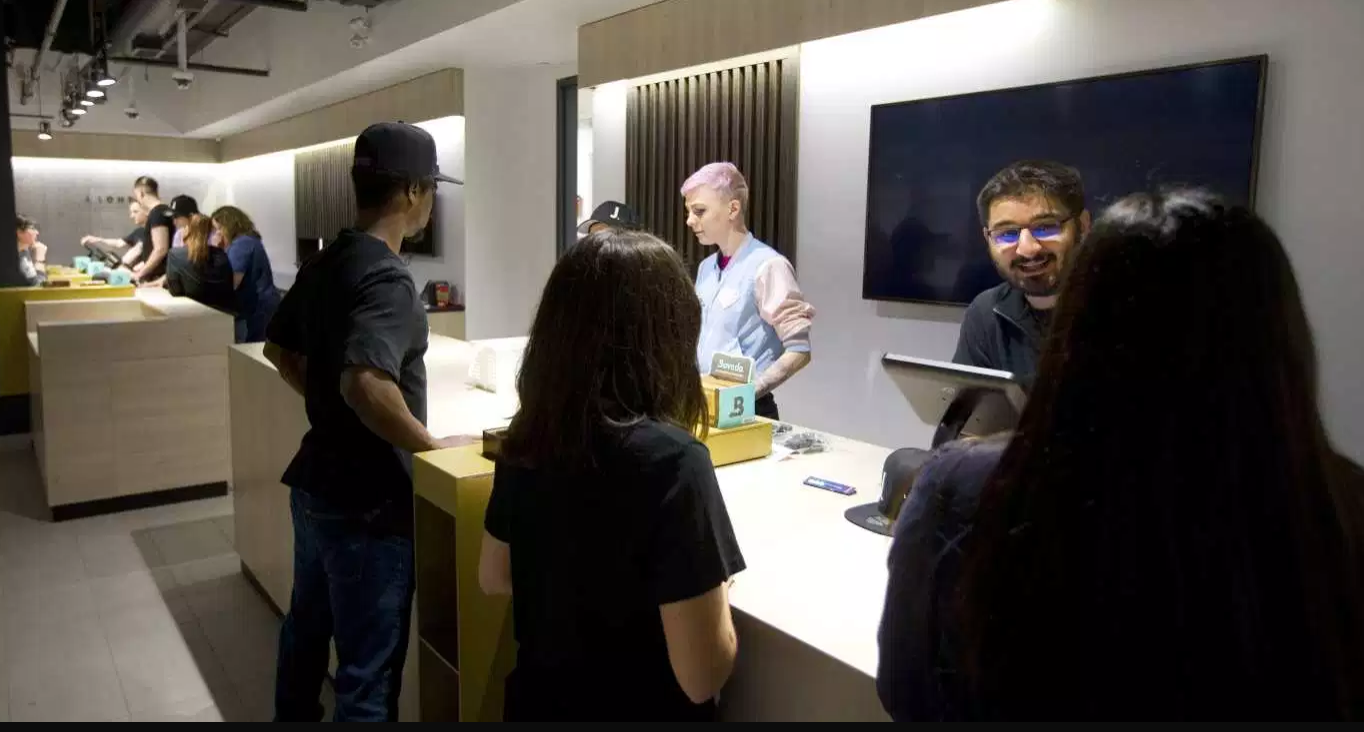 Staff at J. London on Richmond Row get ready Monday for their opening day, on Wednesday. (Mike Hensen/The London Free Press)