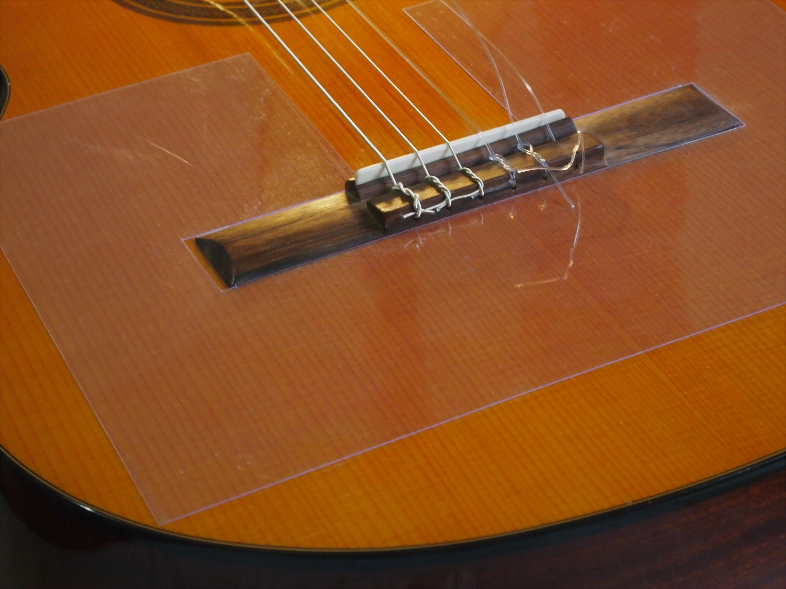 Soundboard Protector Protect your guitar while changing strings