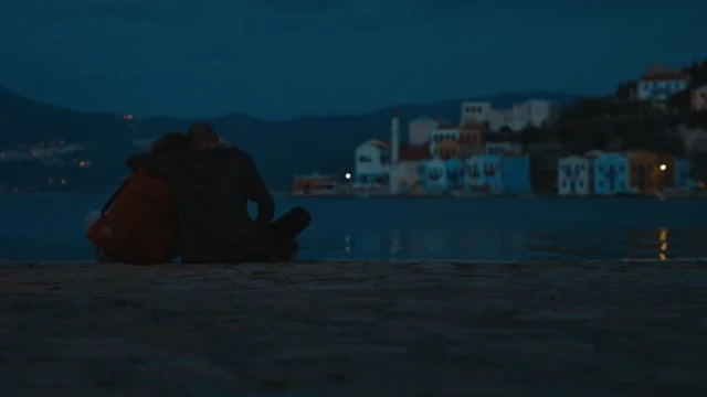 Eyes of Exodus — two figures by the sea at dusk