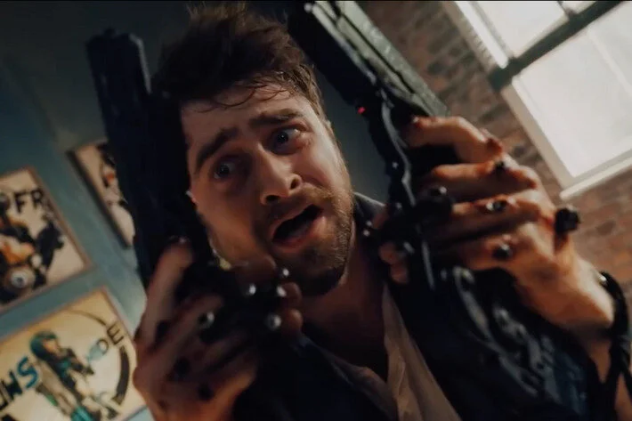 Watch Daniel Radcliffe Fumble With His Gun Hands In The Guns Akimbo Trailer
