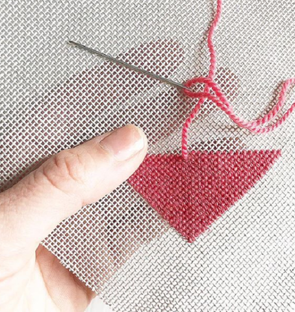 Needlepointing in action