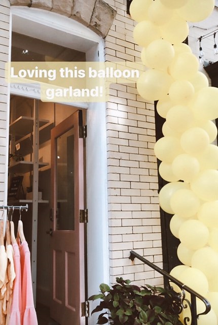 Mission Edit’s balloon garland that they attached to our existing sign frame and hand rail. It was amazing and they made it themselves!