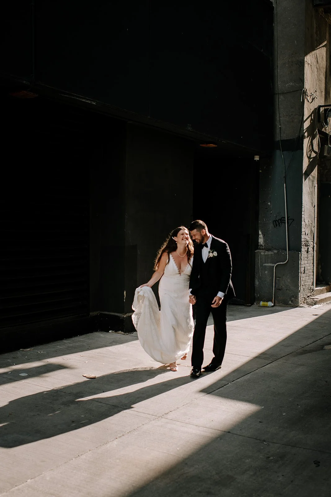 Kaitlin + Ethan - Walking down the back allys behind the burroughs venue, Toronto Wedding Florist
