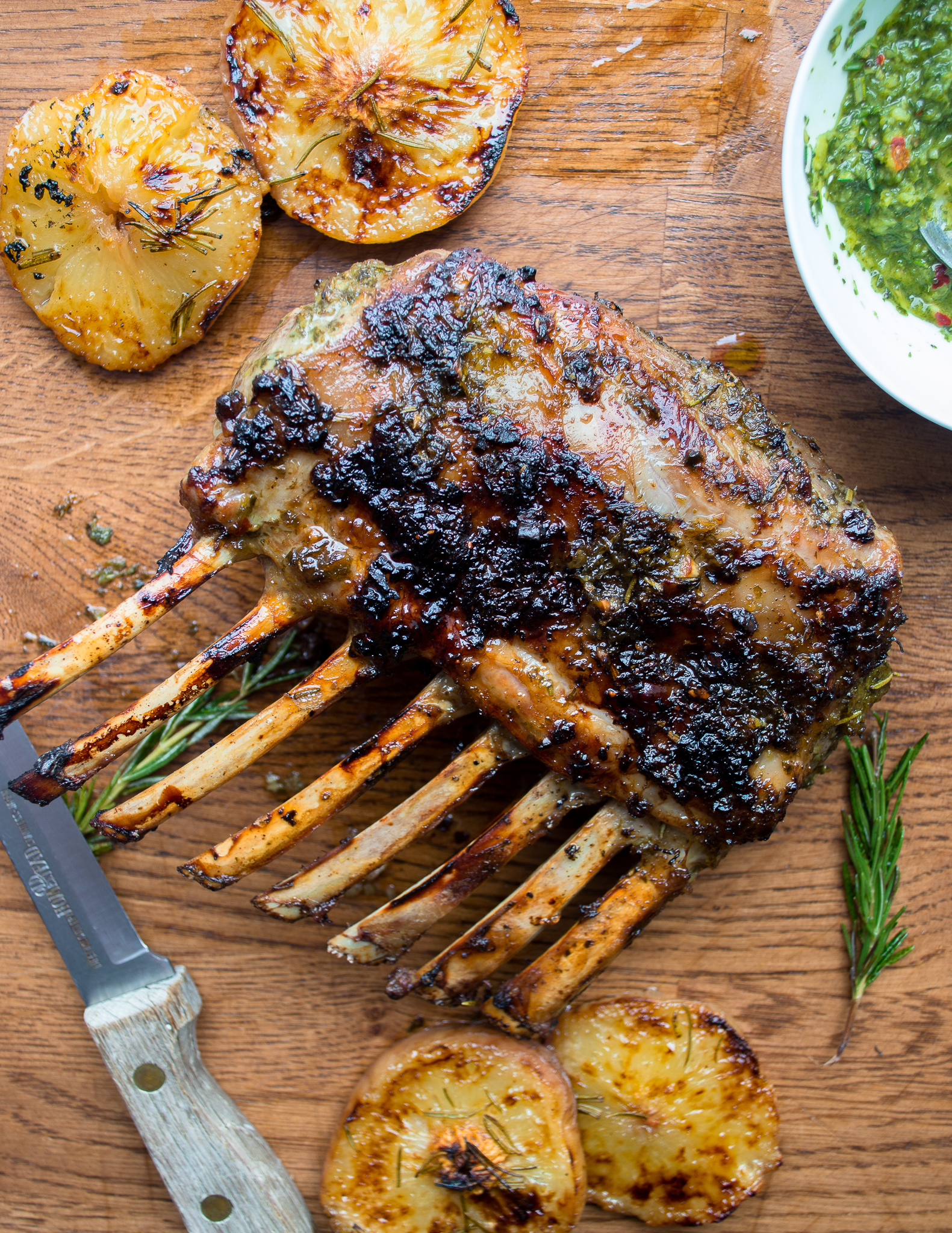 herb crusted rack of lamb with mint chimichurri + roasted peaches