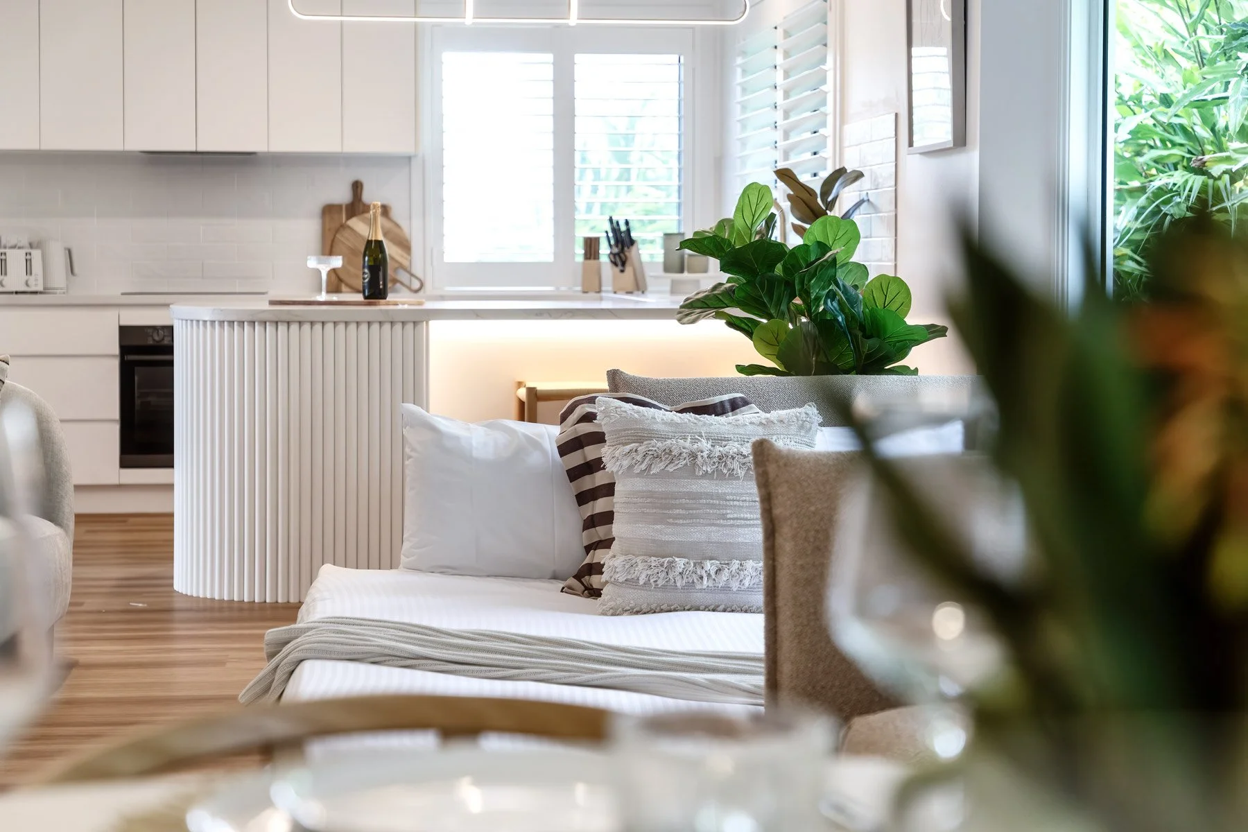  Kitchen bench detail with white cabinetry and indoor plants — 3 Styer Circuit Burleigh Waters 