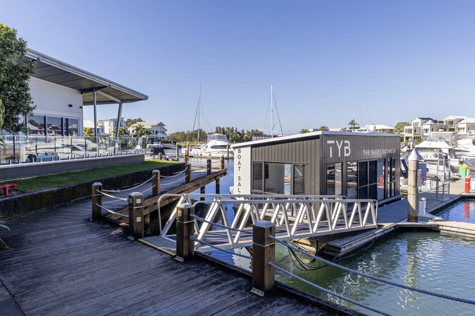  Floating pontoon home moored at a jetty in the Coomera Waters marina. 