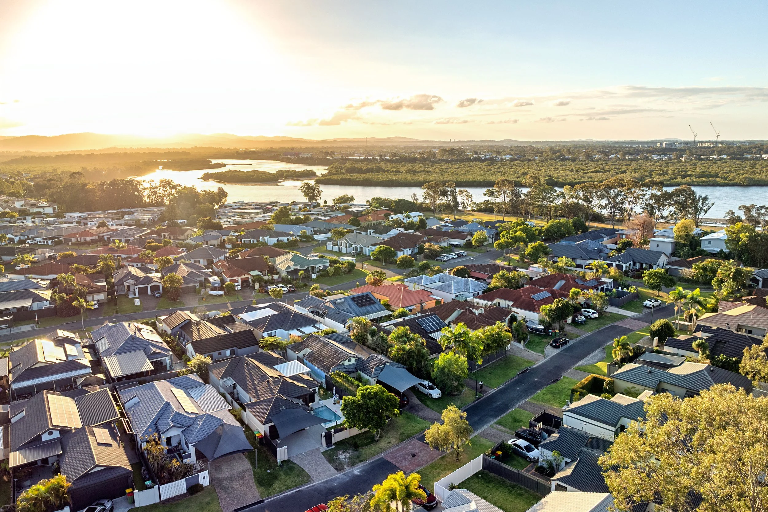  Aerial view of 13 Zac Avenue, Coombabah showing the canal-front position and surrounding waterway community 
